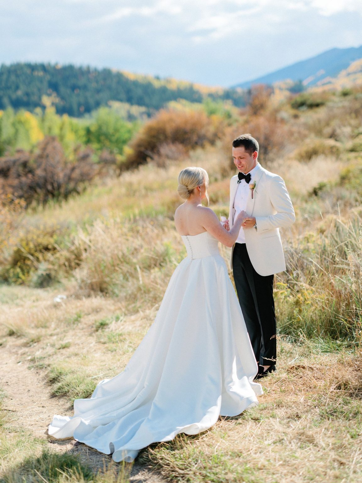 Kayla & Patrick's wedding at the Aspen Chapel and the Caribou Club: the couple in the meadow