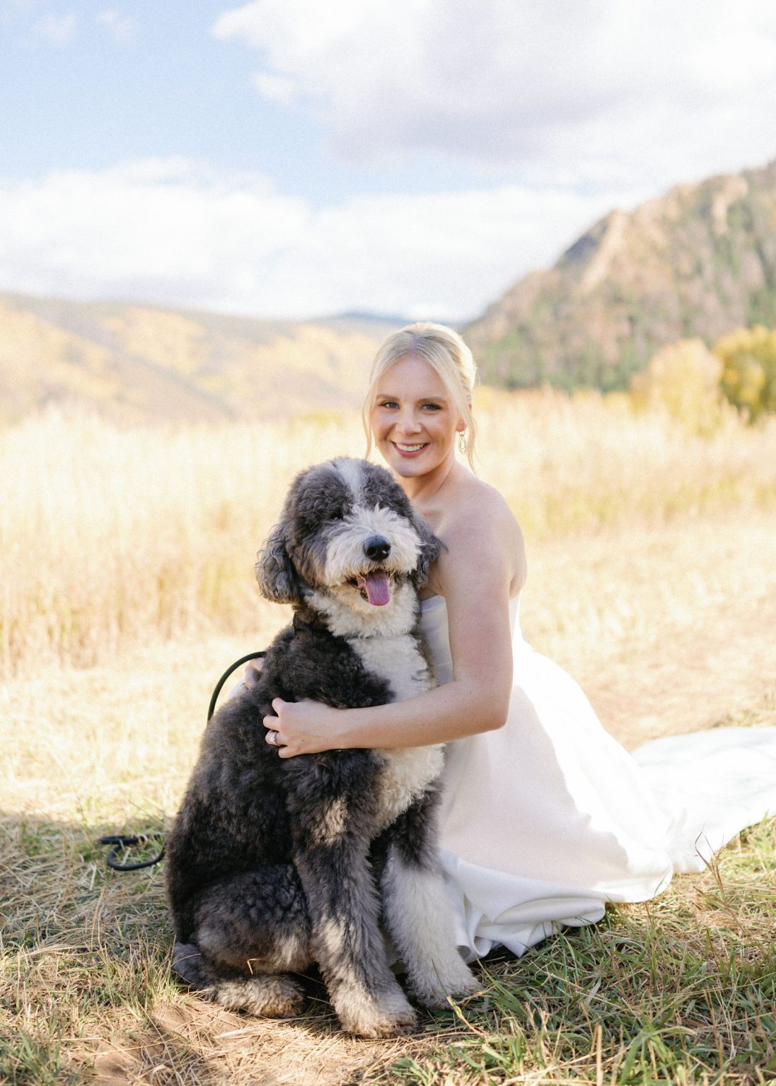 Kayla & Patrick's wedding at the Aspen Chapel and the Caribou Club: the bride with the couple's dog