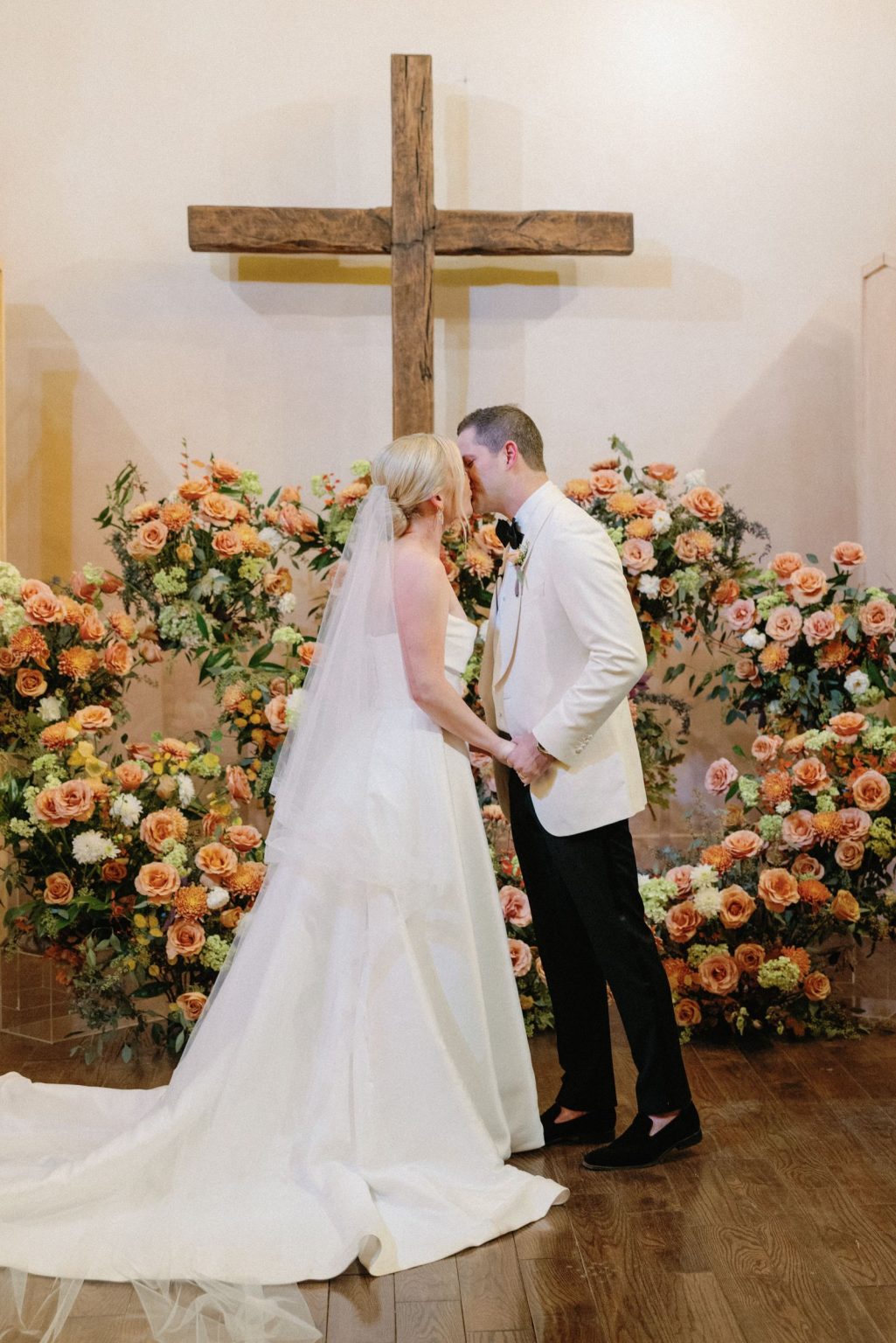 Kayla & Patrick's wedding at the Aspen Chapel and the Caribou Club: a kiss at the altar