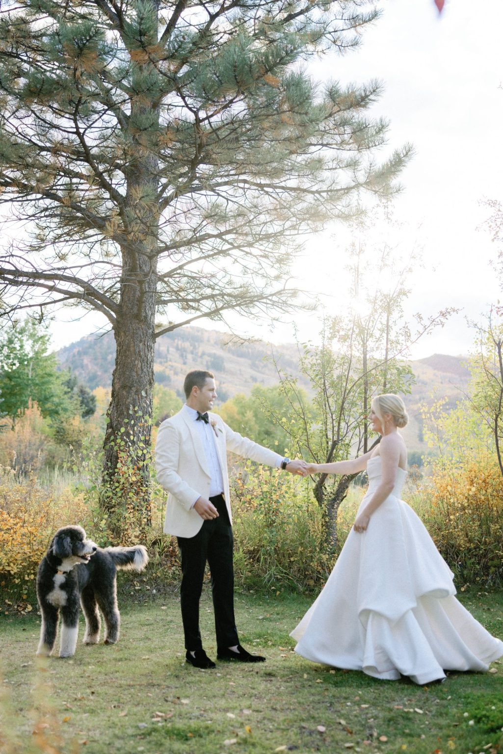 Kayla & Patrick's wedding at the Aspen Chapel and the Caribou Club: the couple among the fall trees