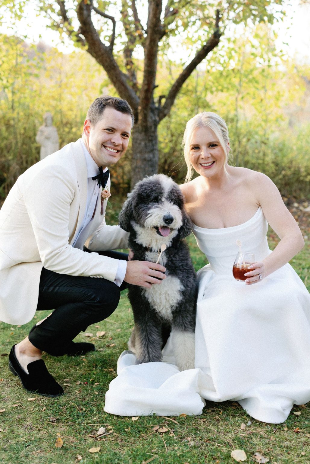 Kayla & Patrick's wedding at the Aspen Chapel and the Caribou Club: the couple with their dog