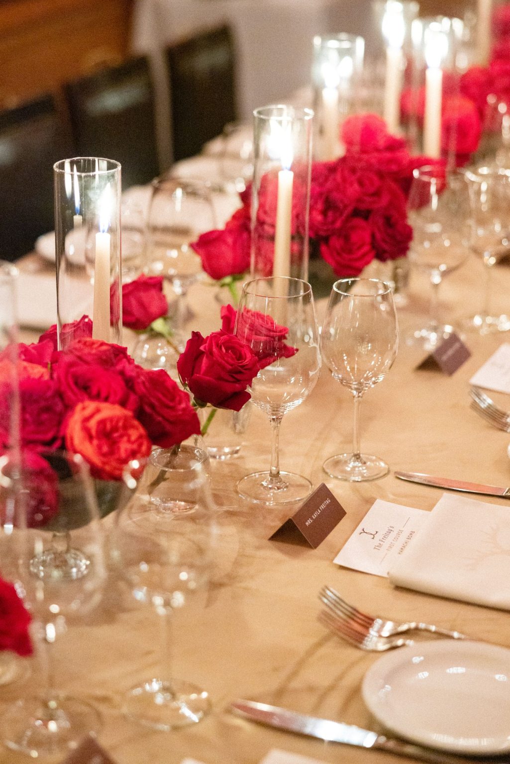 Kayla & Patrick's wedding at the Aspen Chapel and the Caribou Club: red roses and candles at dinner