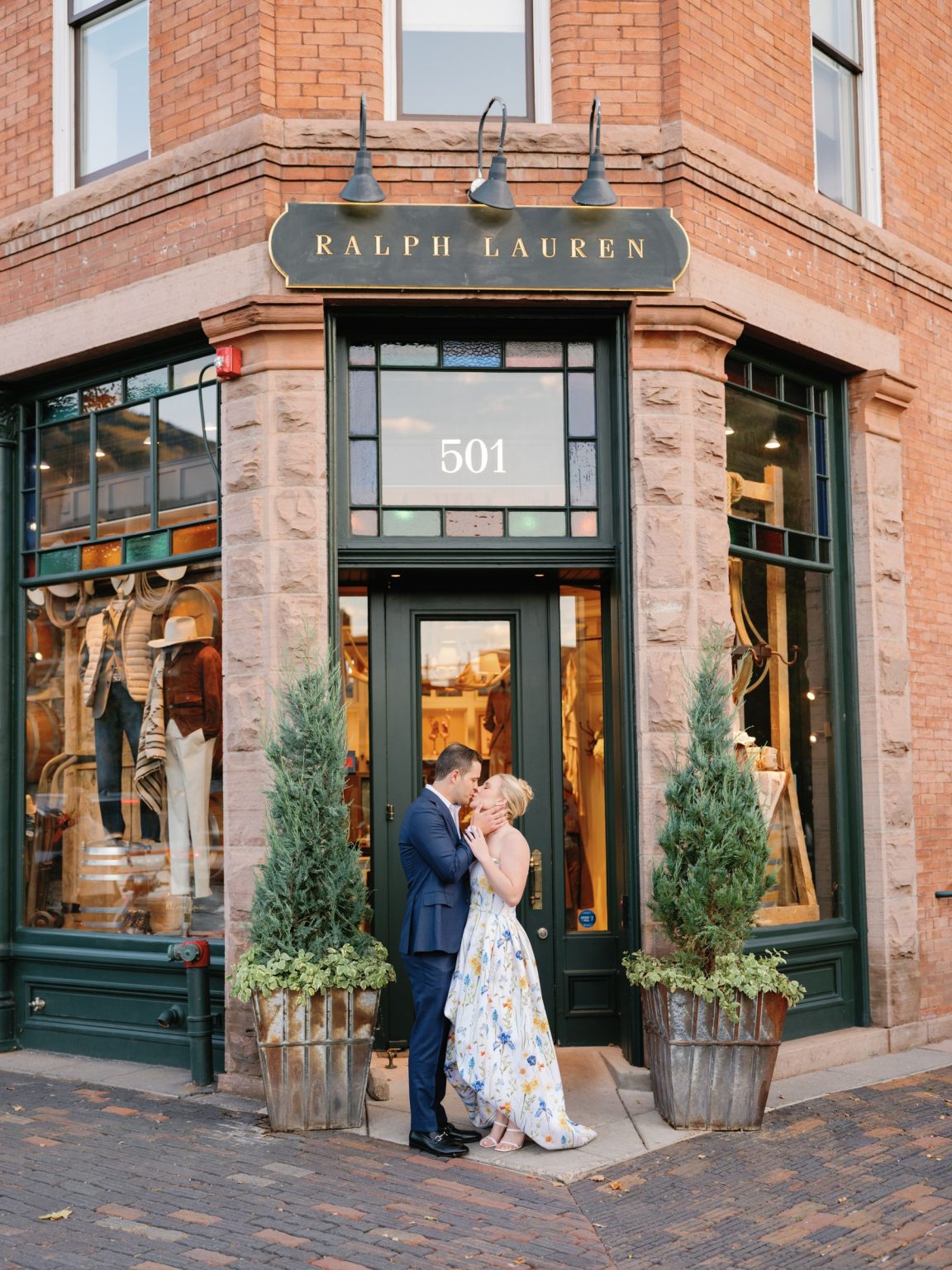 Kayla & Patrick's wedding at the Aspen Chapel and the Caribou Club: a kiss on the streets of Aspen