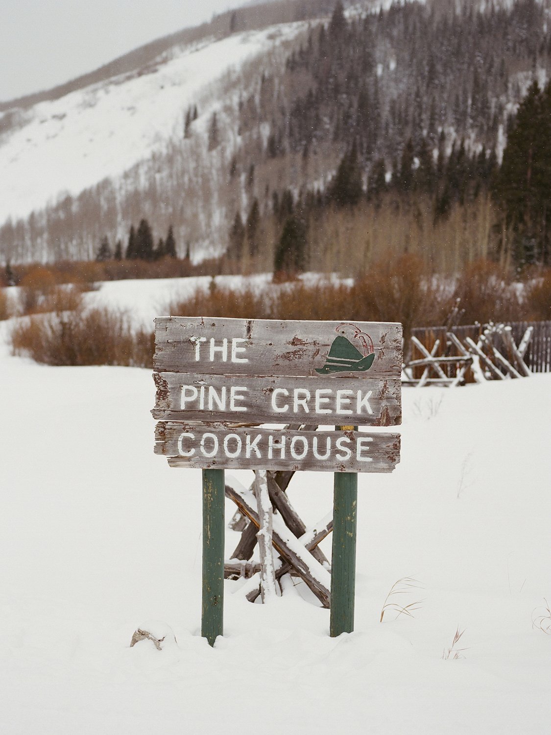 Coley & Teddy's wedding at the Aspen Chapel and Hotel Jerome: the Pine Creek Cookhouse sign in the snow