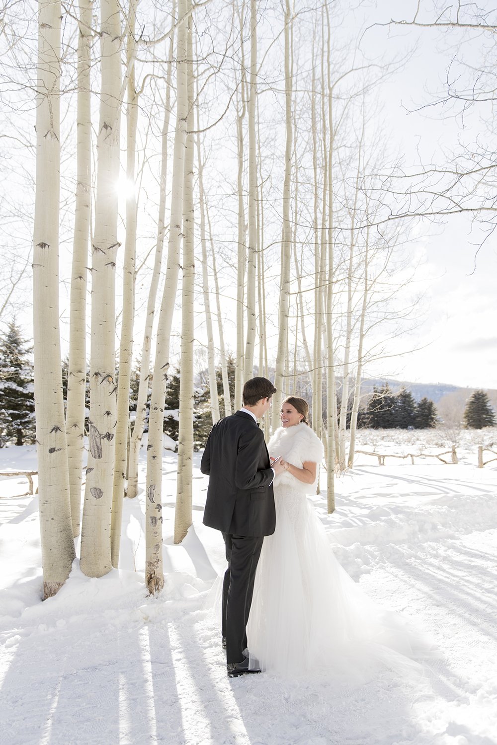 Coley & Teddy's wedding at the Aspen Chapel and Hotel Jerome: the couple among the snowy aspens