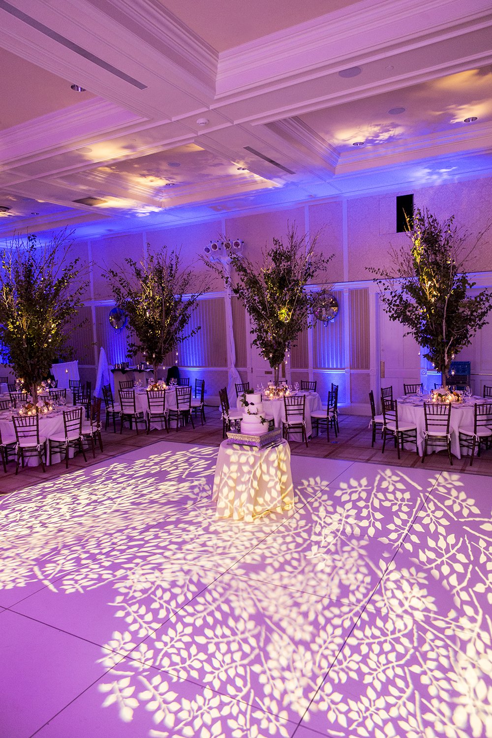 Coley & Teddy's wedding at the Aspen Chapel and Hotel Jerome: the ballroom under purple light