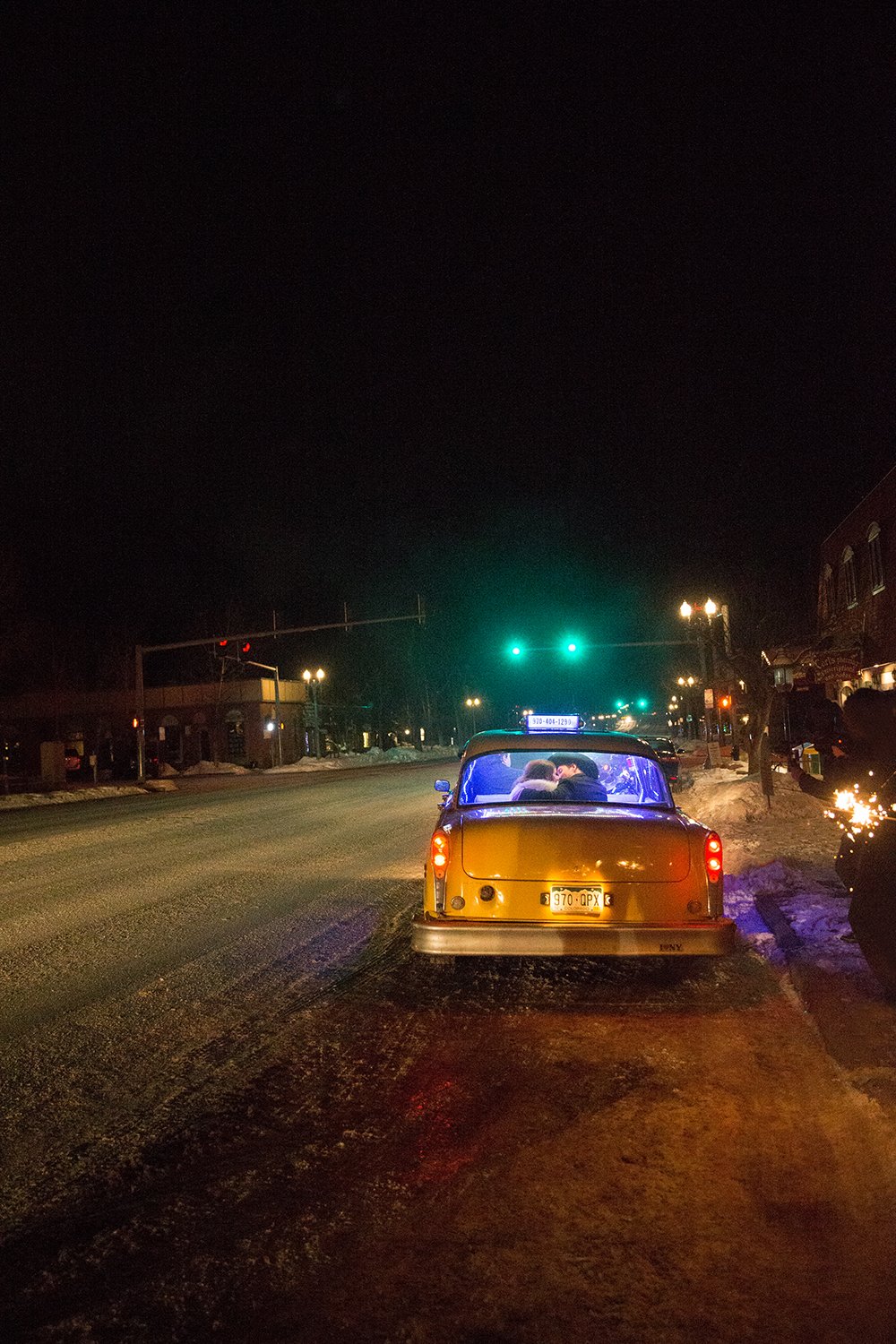 Coley & Teddy's wedding at the Aspen Chapel and Hotel Jerome: departing in the Ultimate Taxi
