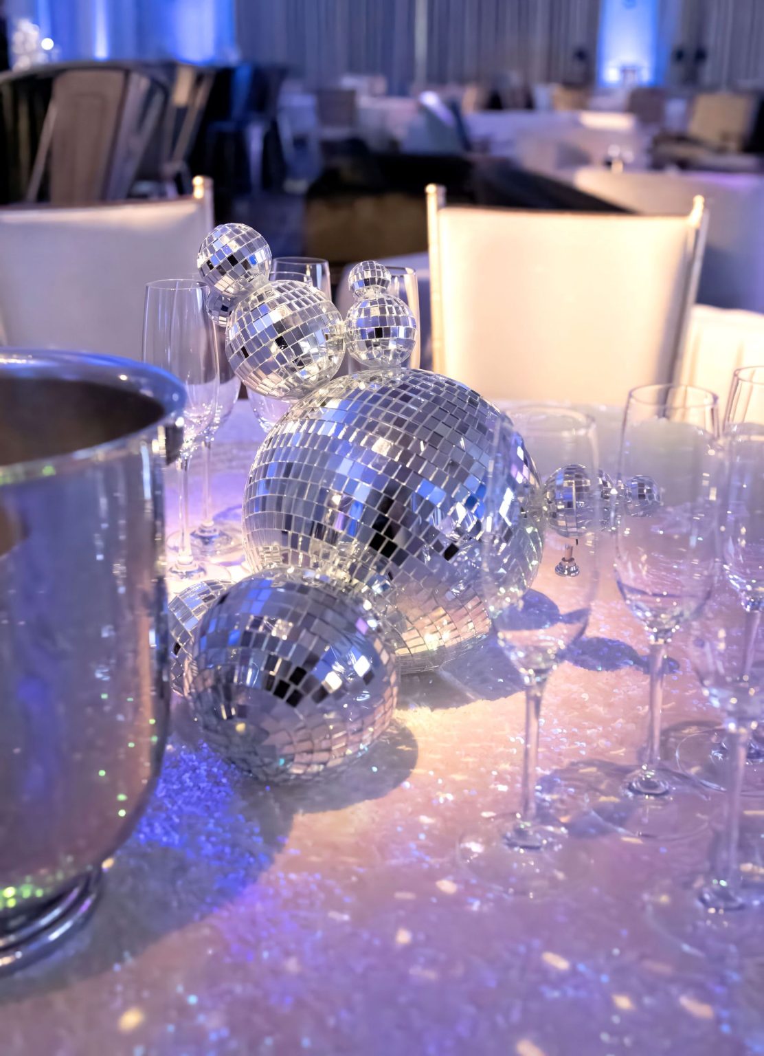 Wildest Dreams, the Aspen Youth Center gala at Hotel Jerome: disco-ball and candle centerpiece on a guest table