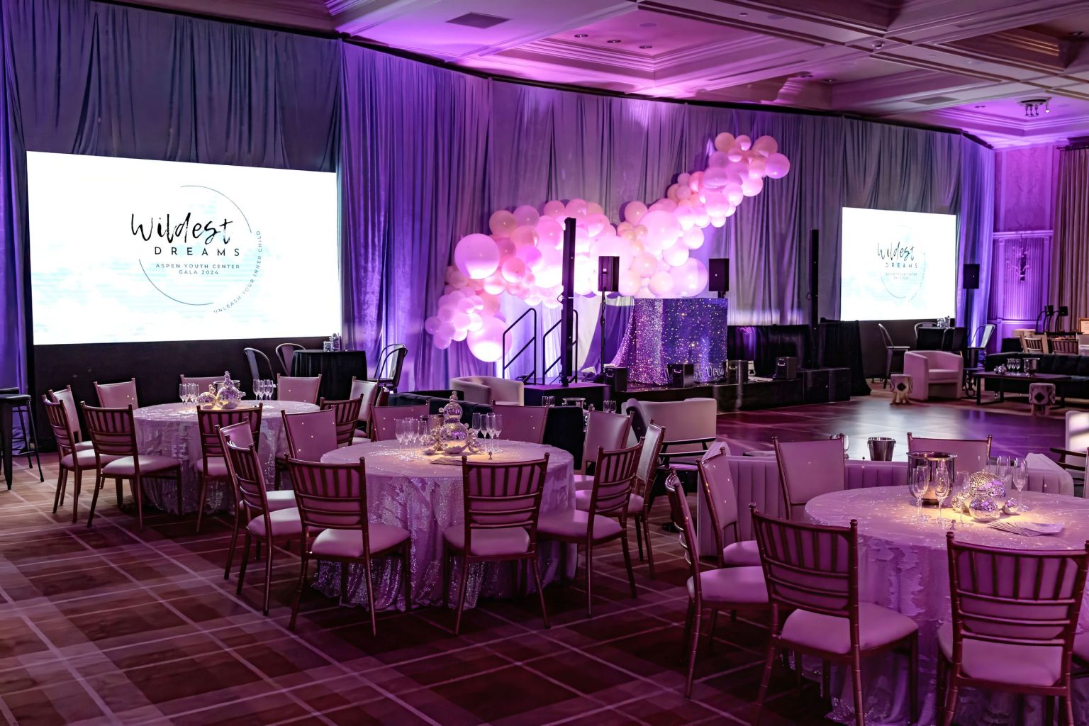 Wildest Dreams, the Aspen Youth Center gala at Hotel Jerome: the ballroom set with lounges, highboys, and tables