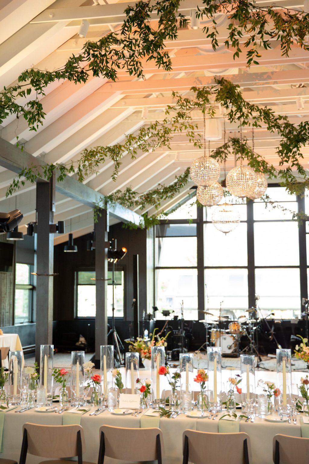 Haley and Sam's wedding at Buttermilk Mountain Lodge, Aspen: Long table set in front of the stage at Buttermilk Mountain Lodge