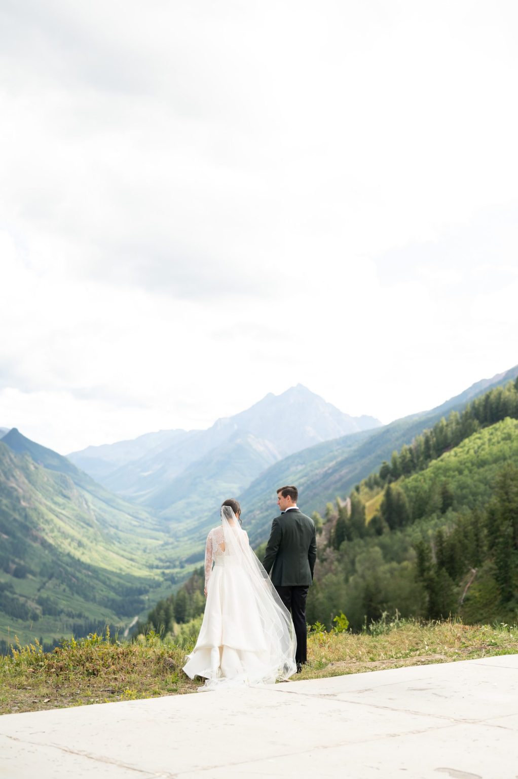 Haley and Sam's wedding at Buttermilk Mountain, Aspen: the couple looking down the valley toward Pyramid Peak