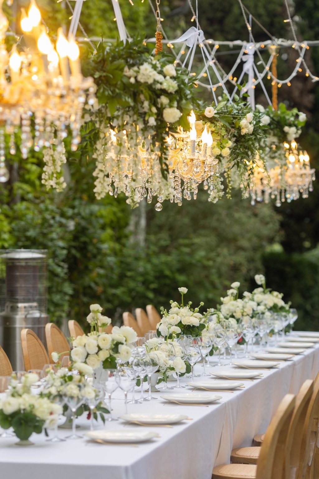Château Saint Joseph FAM trip in the South of France: a long table set beneath chandeliers on the terrace