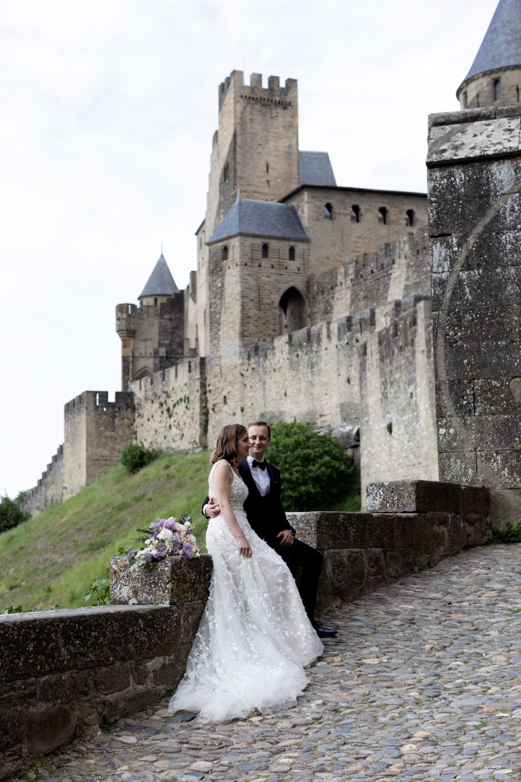 Château Saint Joseph FAM trip in the South of France: the couple beneath the walls of Carcassonne