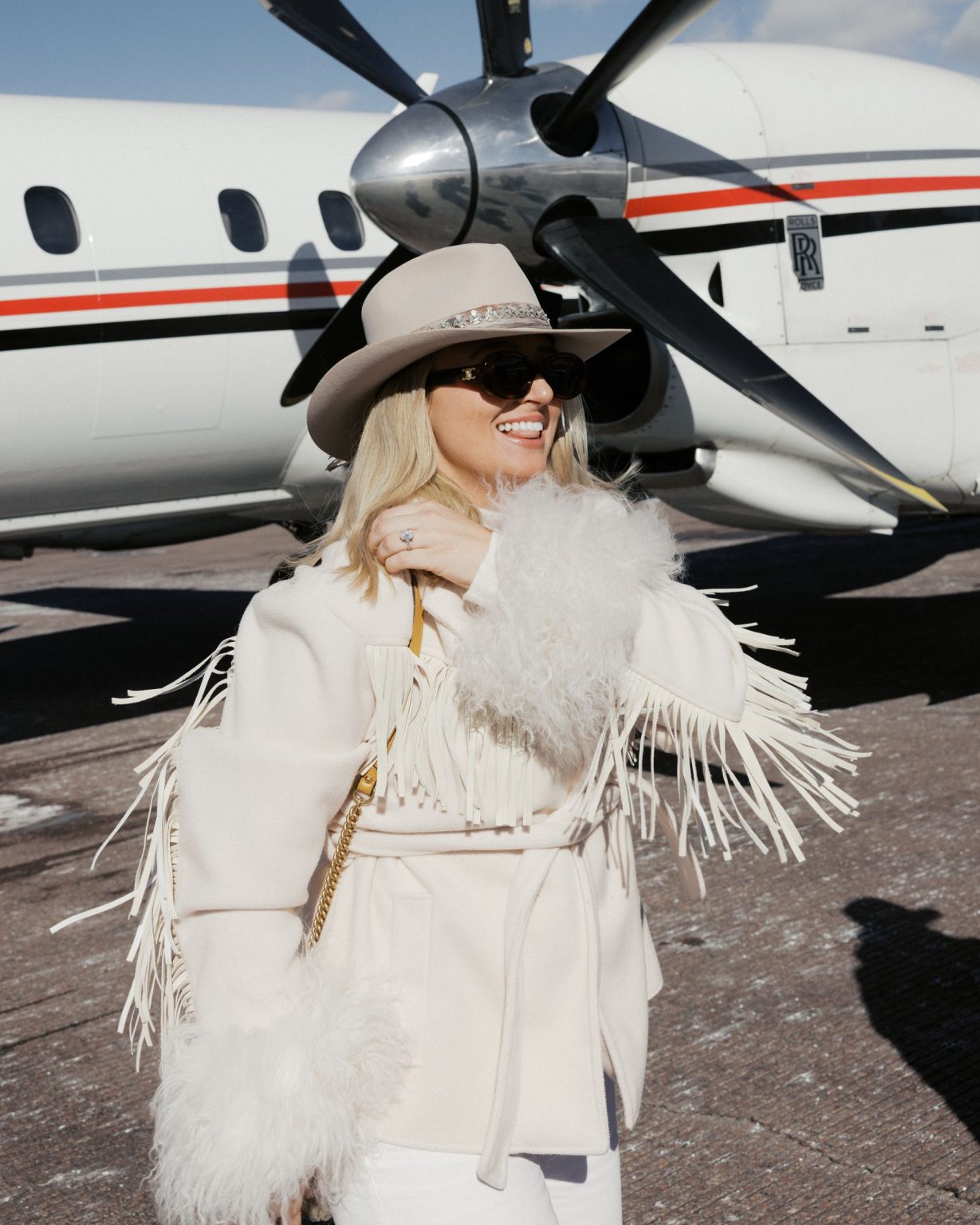 Hayley's Aspen bachelorette weekend: Hayley on the tarmac in white fringe