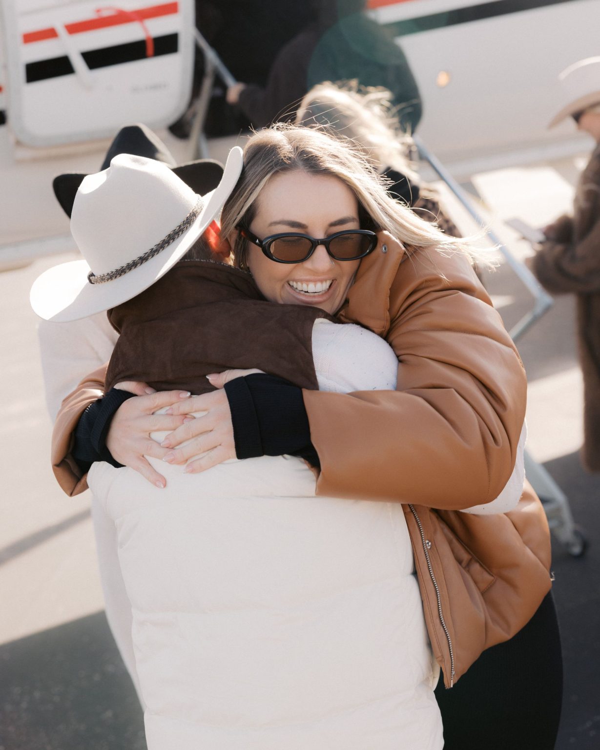 Hayley's Aspen bachelorette weekend: a welcome hug on the tarmac
