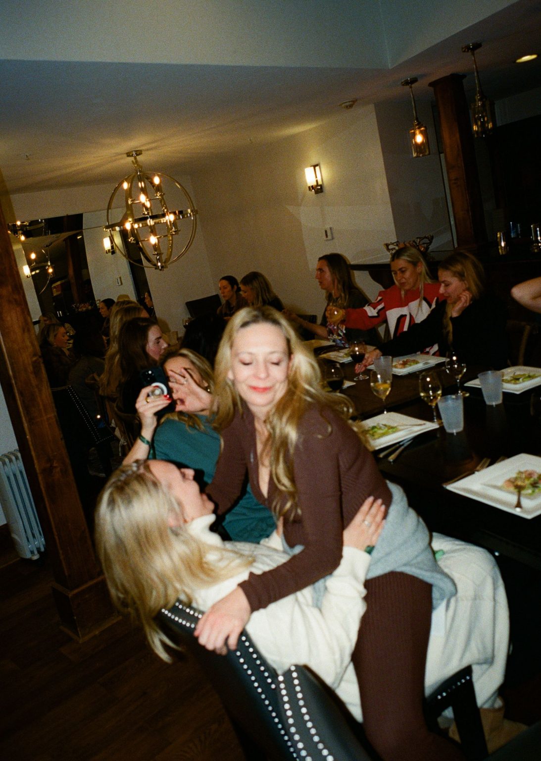 Hayley's Aspen bachelorette weekend: a hug at dinner at the house