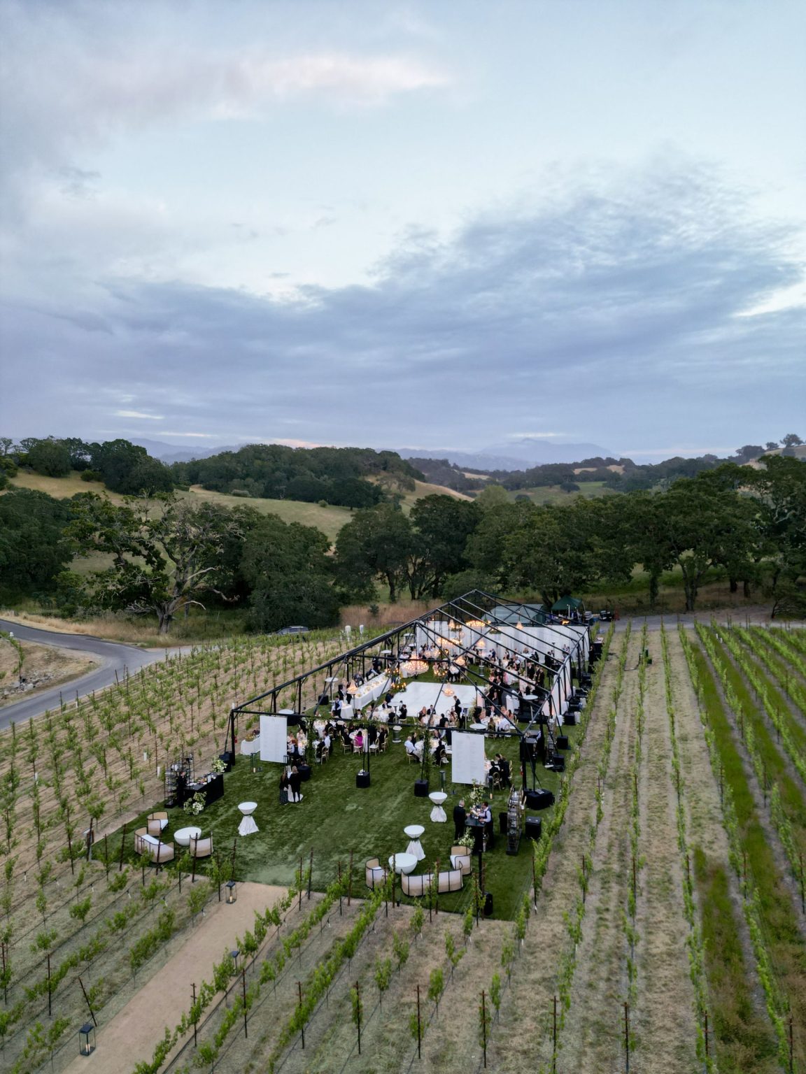 Sydney and Keaton's destination wedding at Montage Healdsburg, California: the reception tent on the Grand Lawn
