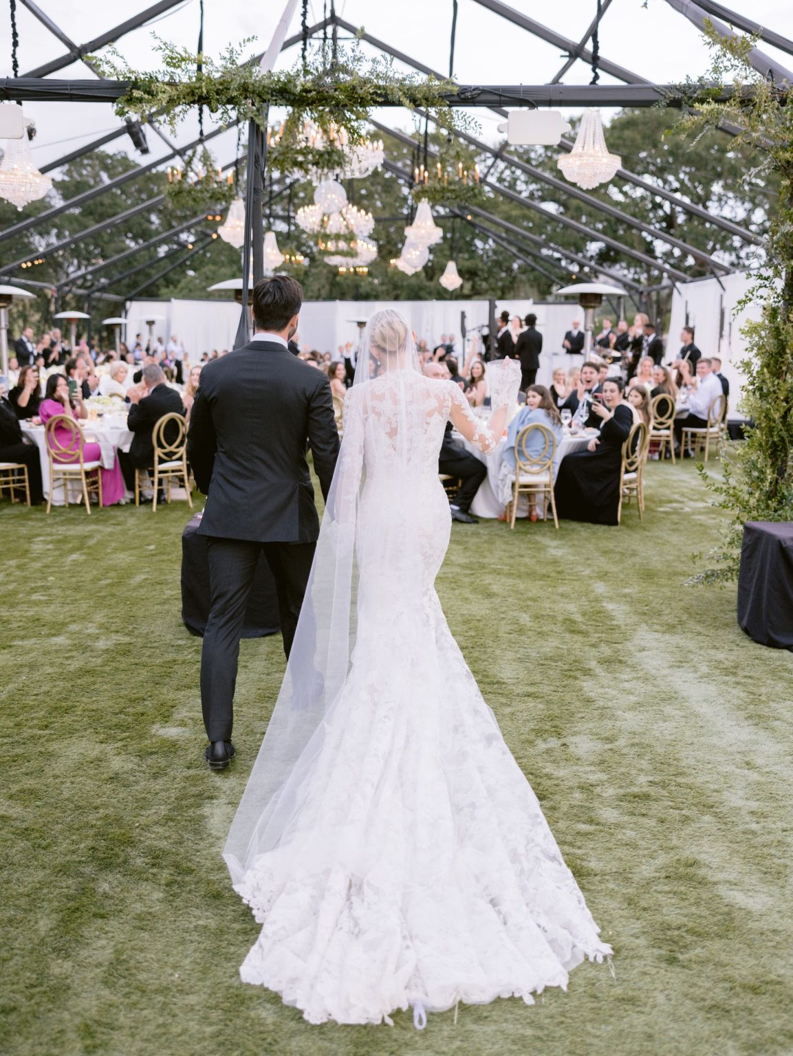 Sydney and Keaton's destination wedding at Montage Healdsburg, California: the reception tent on the Grand Lawn