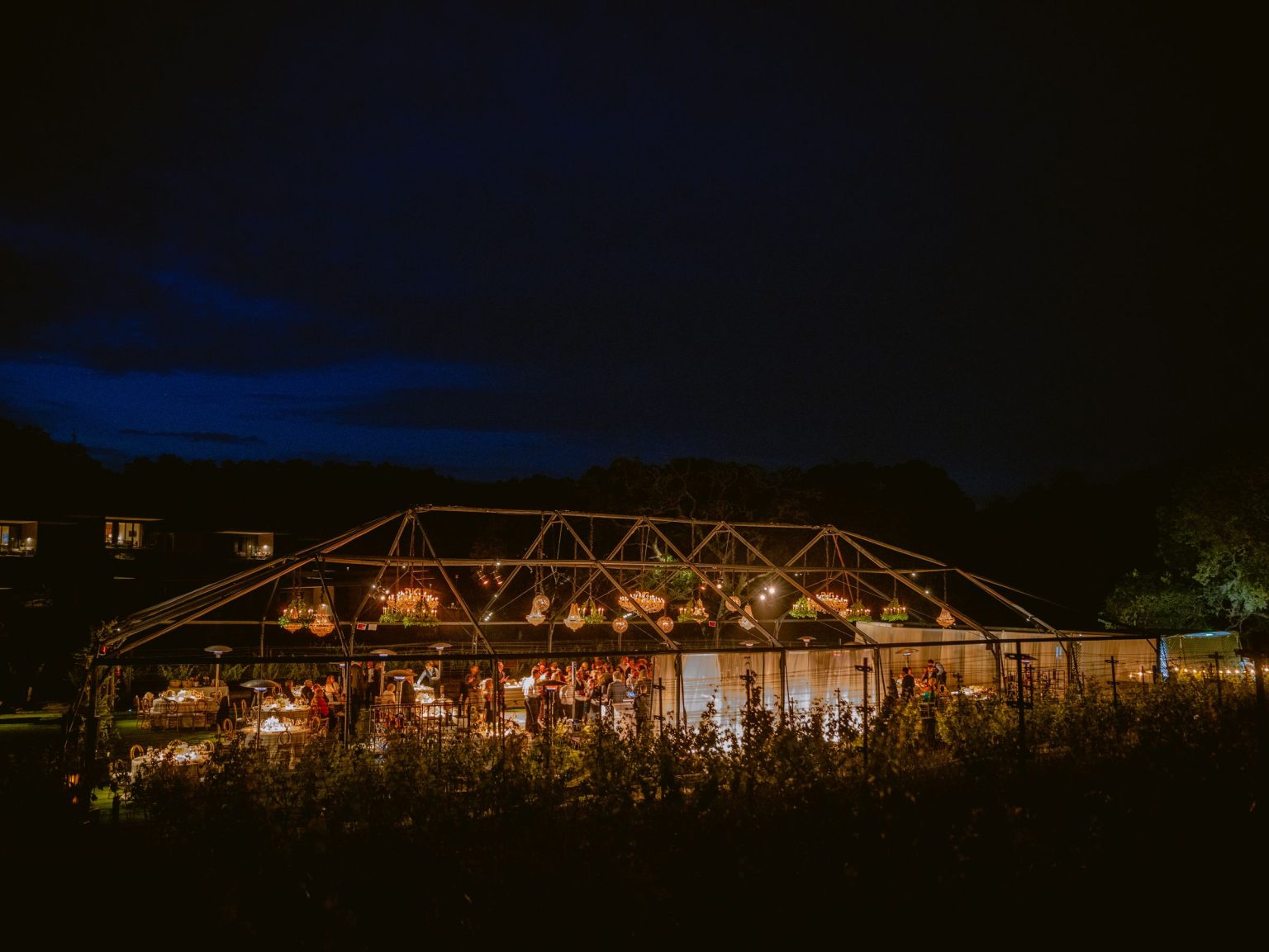 Sydney and Keaton's destination wedding at Montage Healdsburg, California: the reception tent on the Grand Lawn