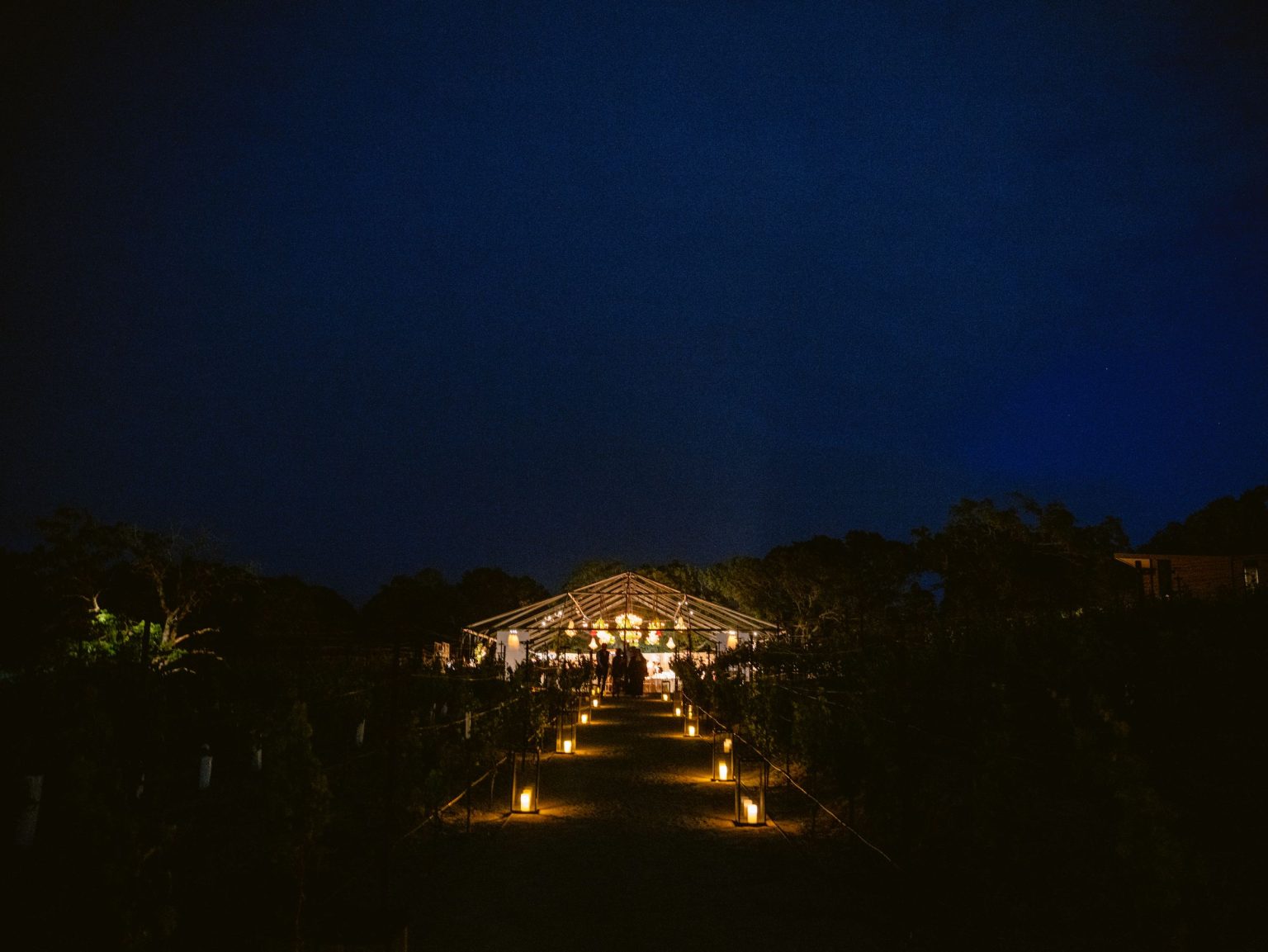 Sydney and Keaton's destination wedding at Montage Healdsburg, California: the reception tent on the Grand Lawn