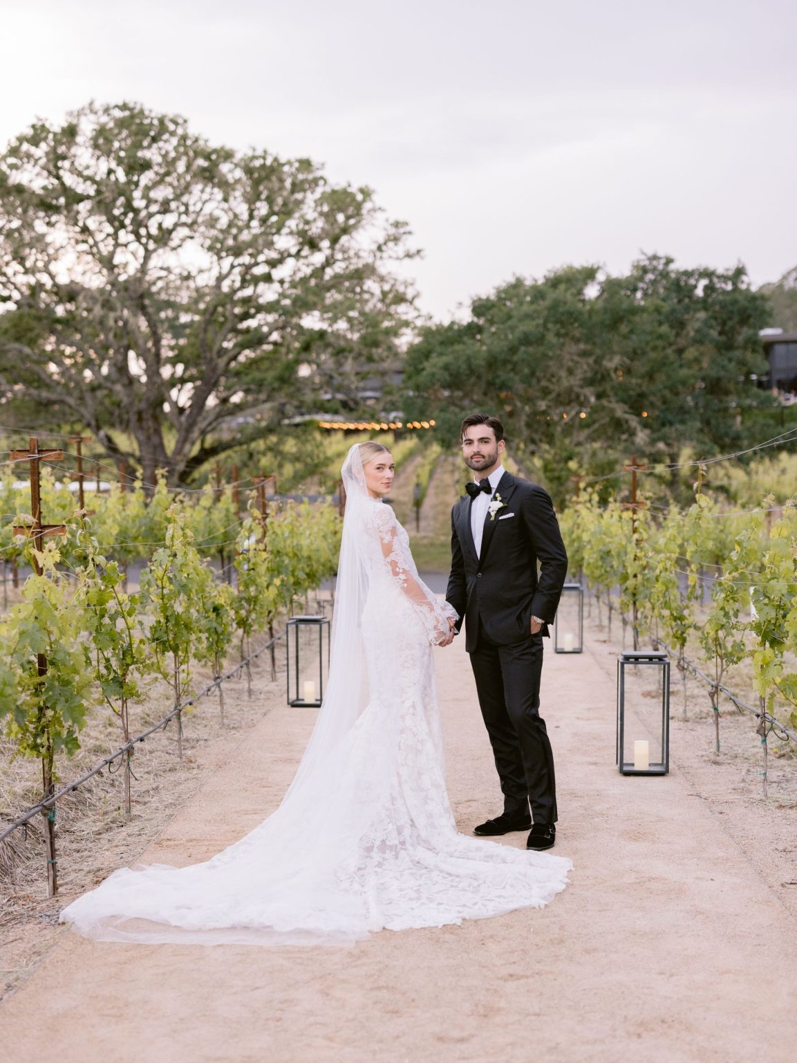 Sydney and Keaton's wedding at Montage Healdsburg, California: the couple in the vineyard at golden hour