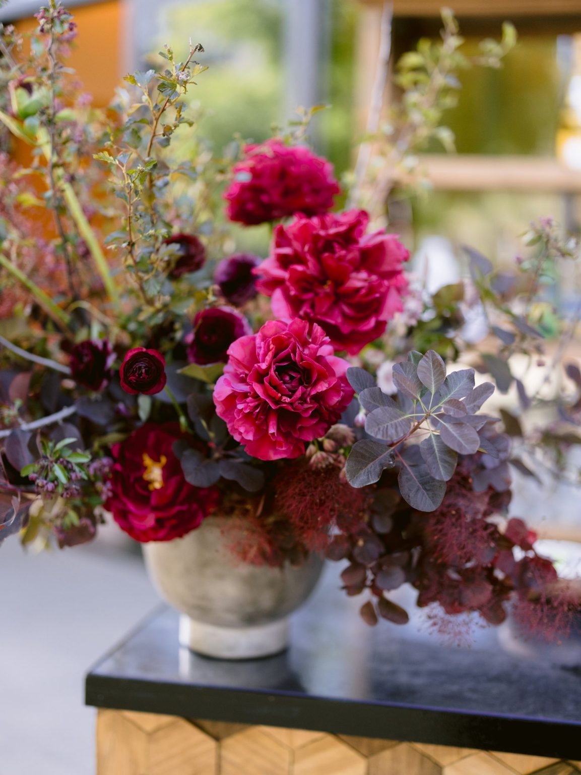 Sydney and Keaton's wedding at Montage Healdsburg, California: deep red welcome party florals