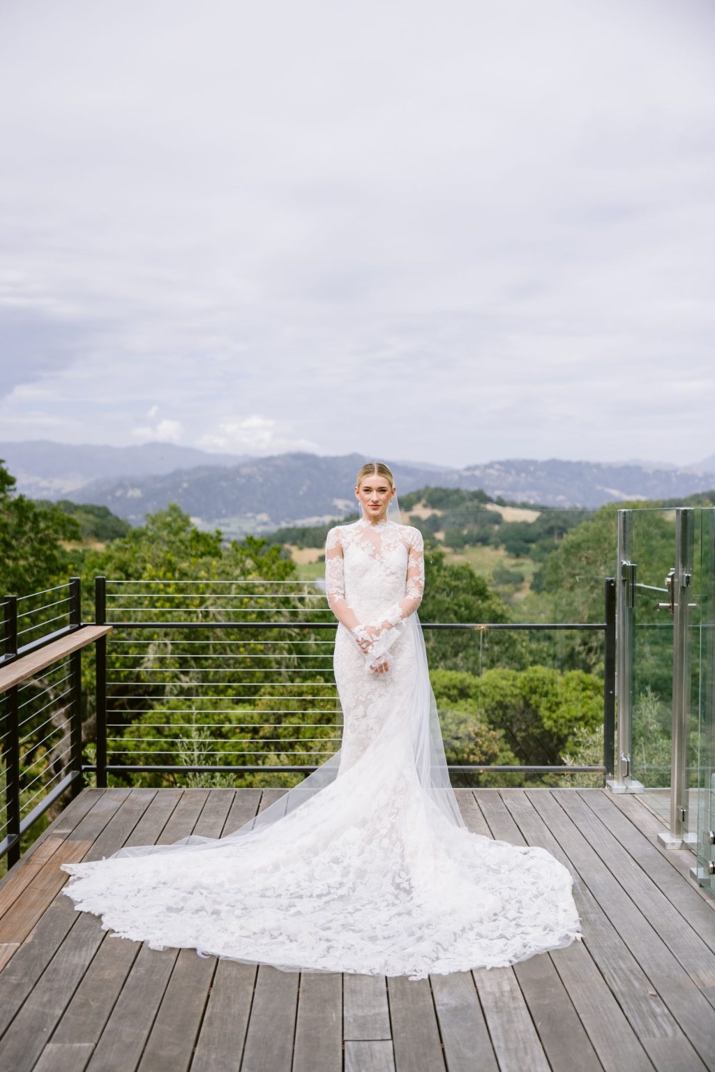 Sydney and Keaton's wedding at Montage Healdsburg, California: the bride on the terrace above the valley
