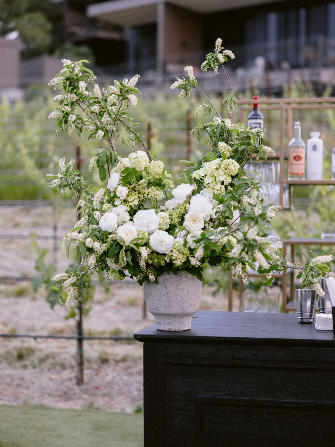 Sydney and Keaton's wedding at Montage Healdsburg, California: white florals at the bar