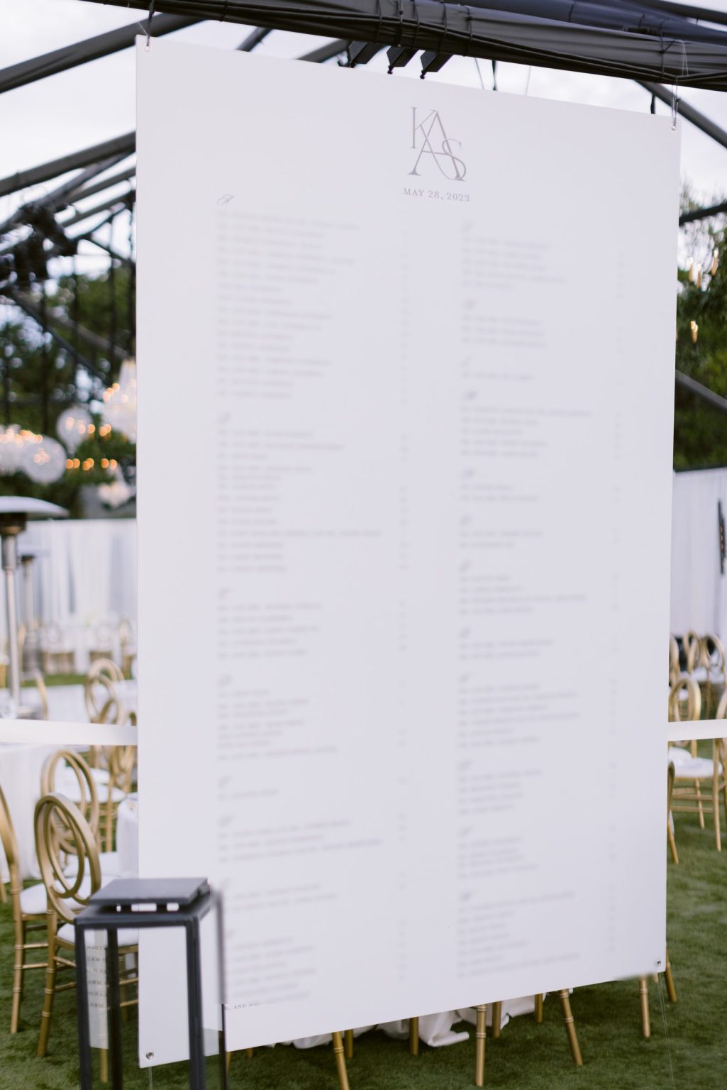 Sydney and Keaton's wedding at Montage Healdsburg, California: Carta Blanc escort display hung from the reception tent frame