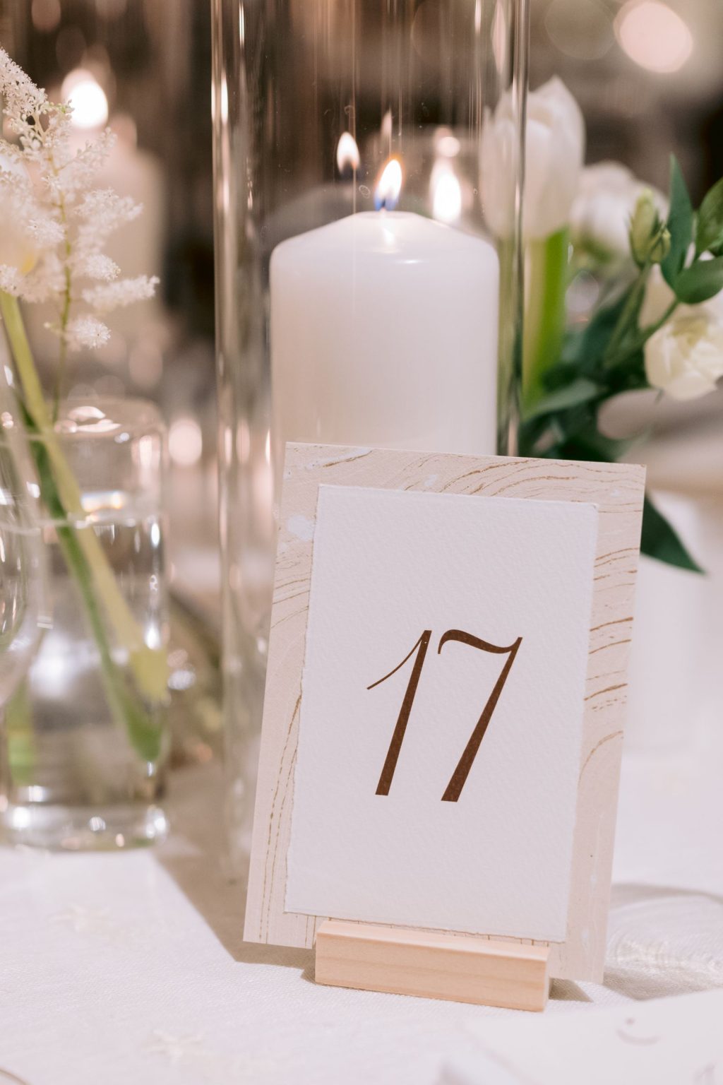Addy & Nick's wedding at Hotel Jerome, Aspen: a table number and white candles