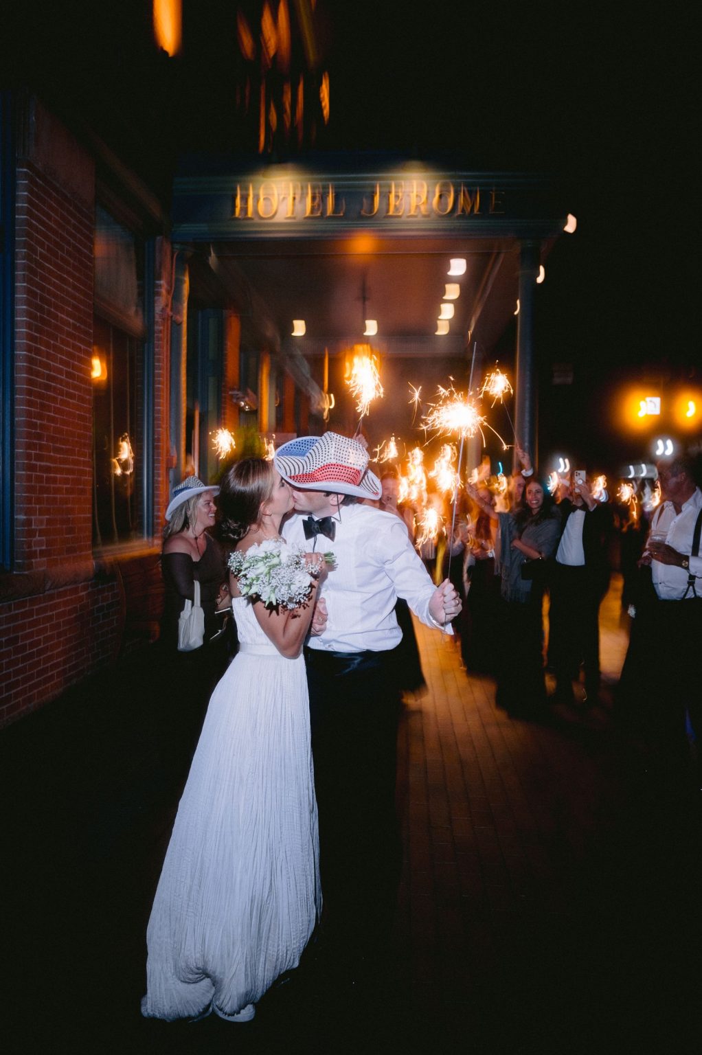 Addy & Nick's wedding at Hotel Jerome, Aspen: the couple leaving through the sparklers