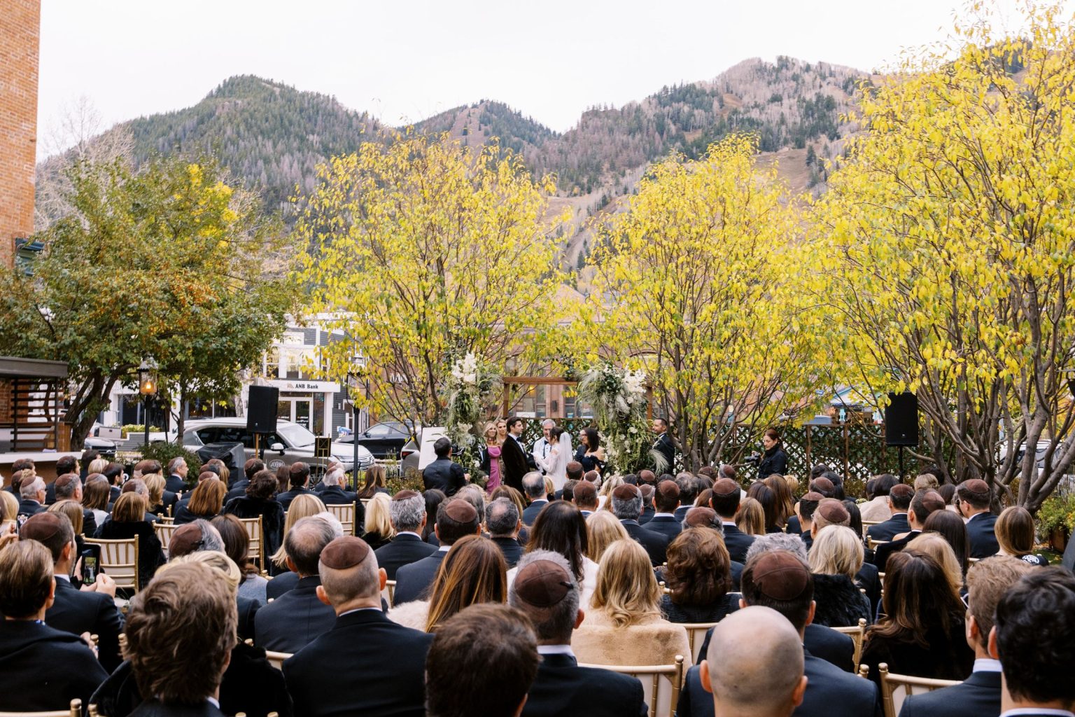 Abby & David's wedding at Hotel Jerome, Aspen: the ceremony in the Hotel Jerome courtyard beneath Aspen Mountain