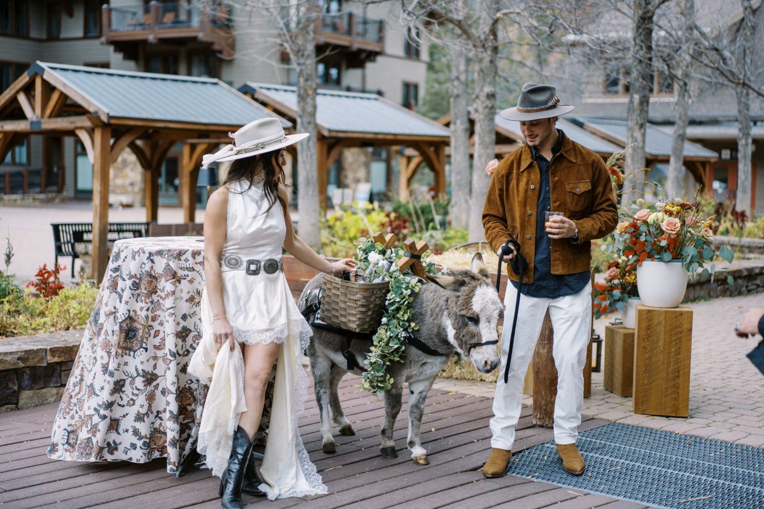 Abby & David's wedding at Hotel Jerome, Aspen: the couple with a burro at the welcome party