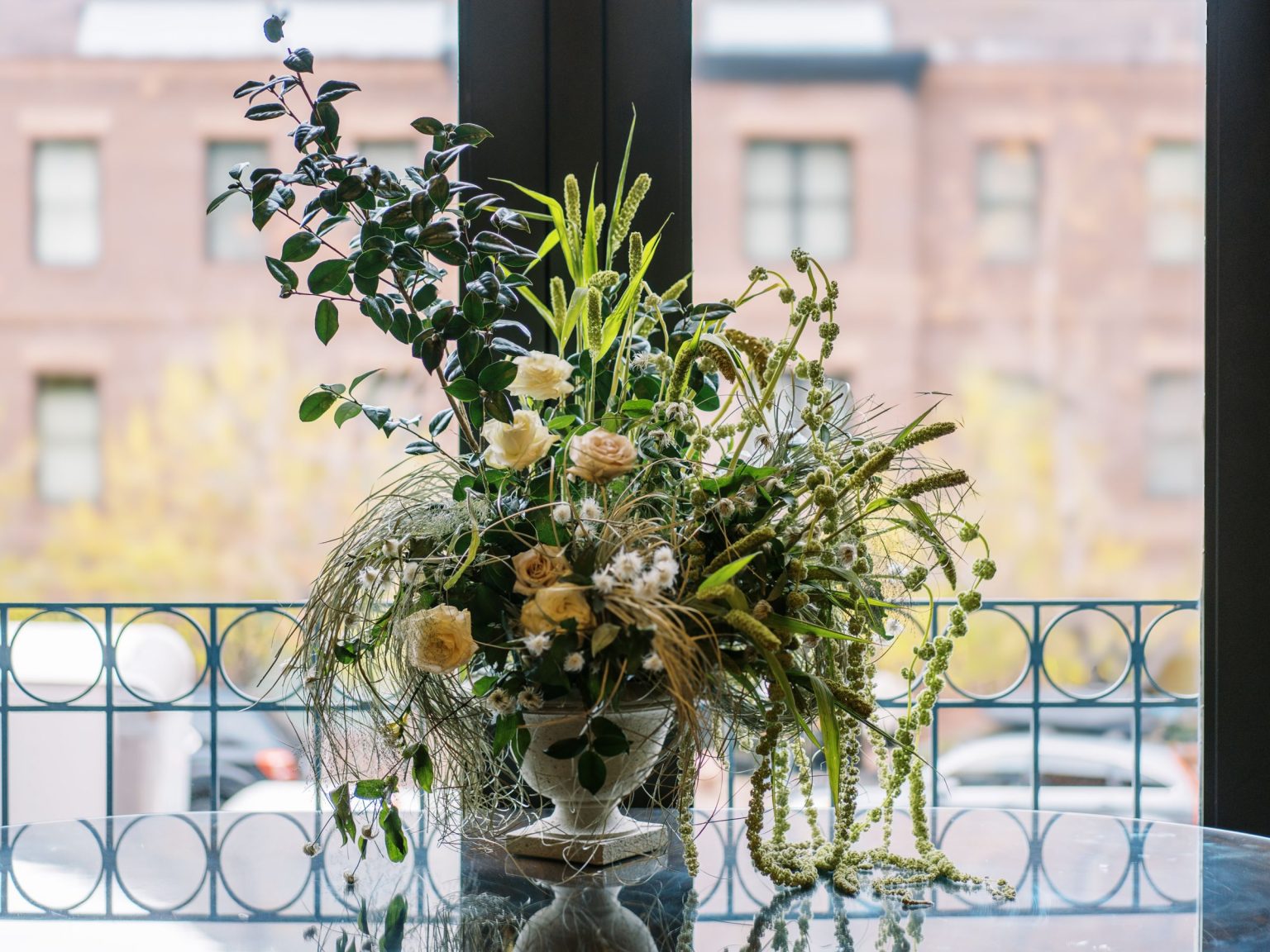 Abby & David's wedding at Hotel Jerome, Aspen: an arrangement in the ballroom window