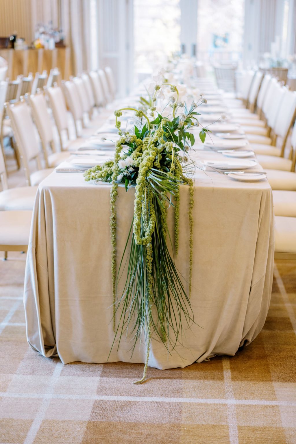 Abby & David's wedding at Hotel Jerome, Aspen: trailing greenery on a long table