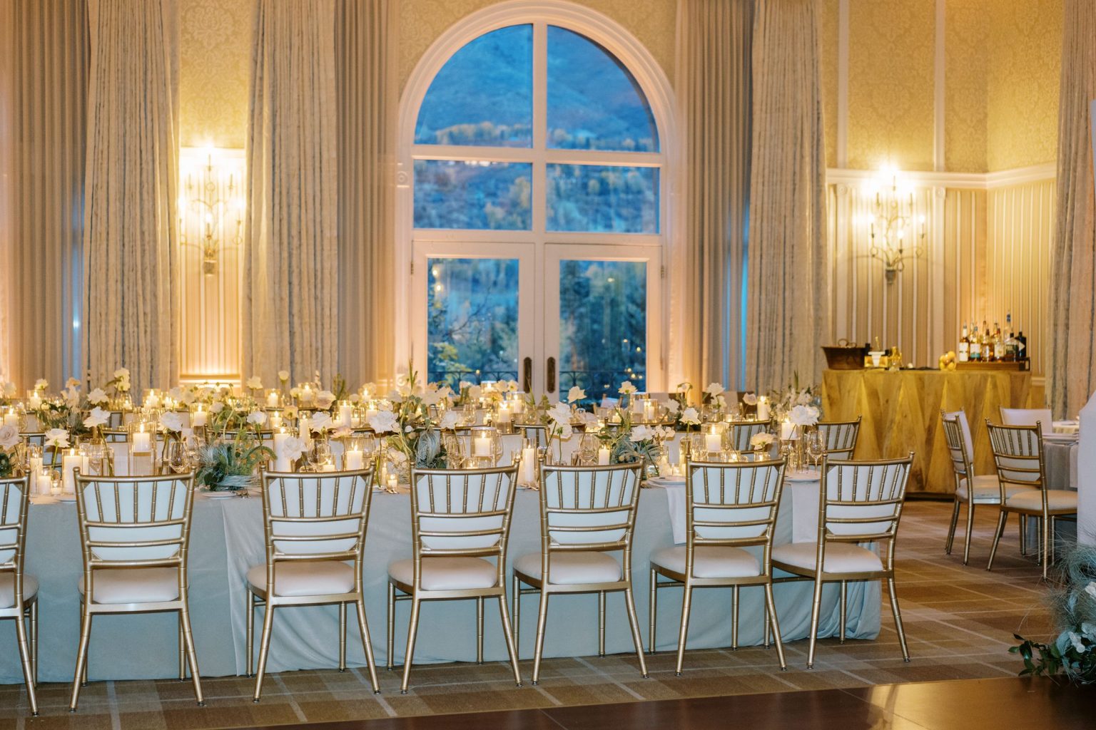 Abby & David's wedding at Hotel Jerome, Aspen: the ballroom beneath the arched windows