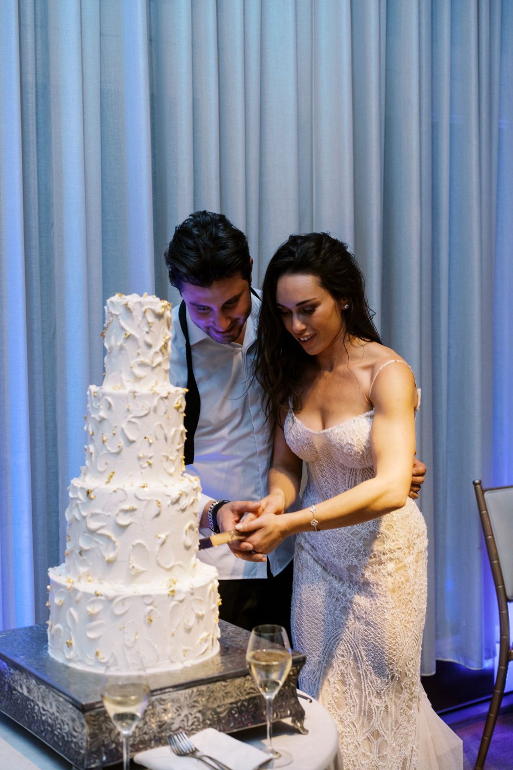 Abby & David's wedding at Hotel Jerome, Aspen: cutting the cake