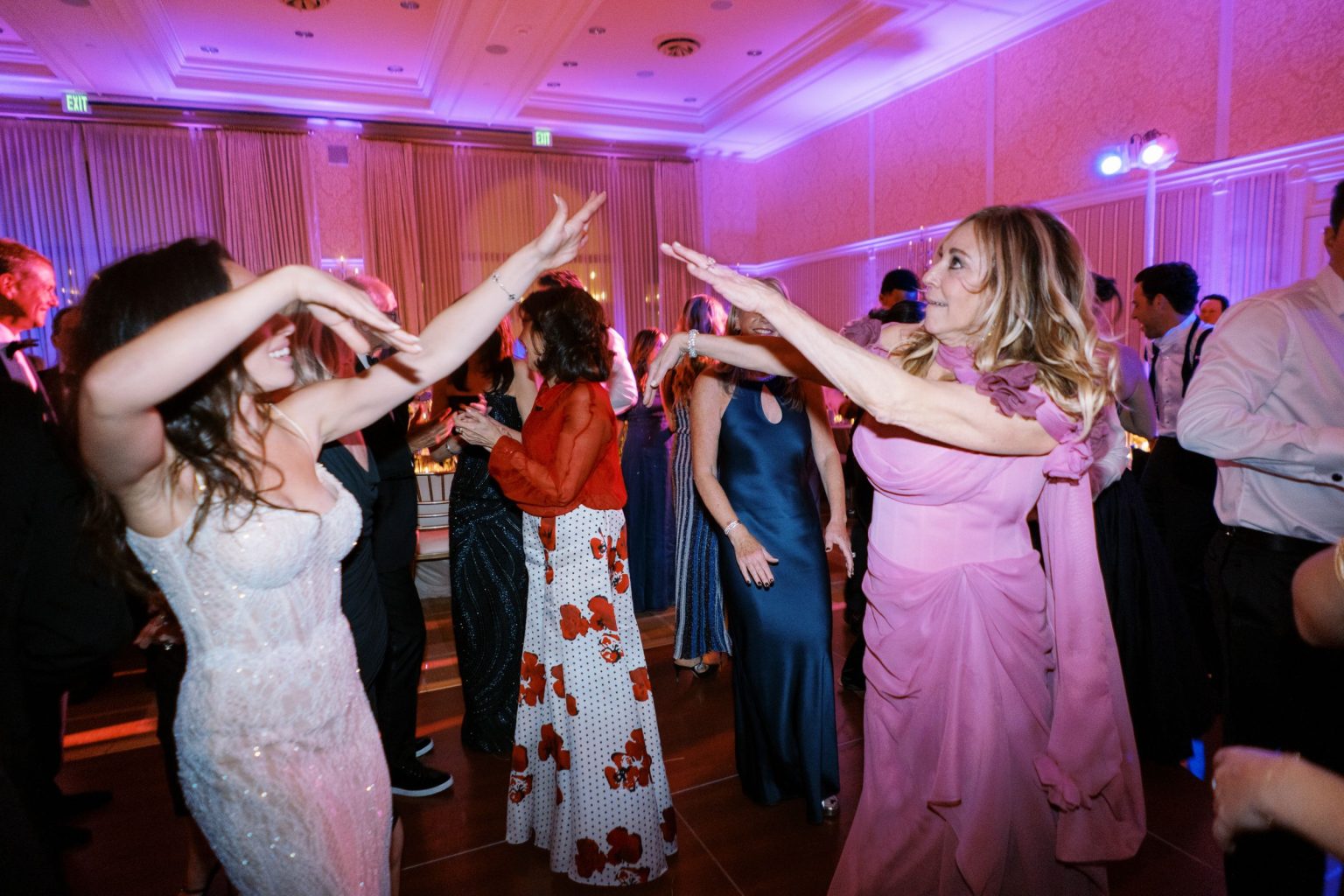 Abby & David's wedding at Hotel Jerome, Aspen: dancing under pink light