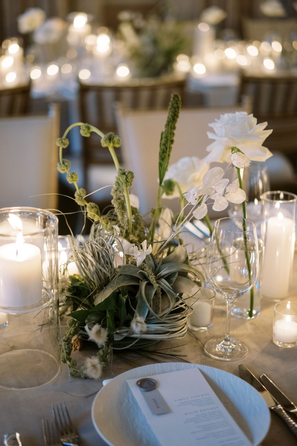Abby & David's wedding at Hotel Jerome, Aspen: a centerpiece of orchids and air plants