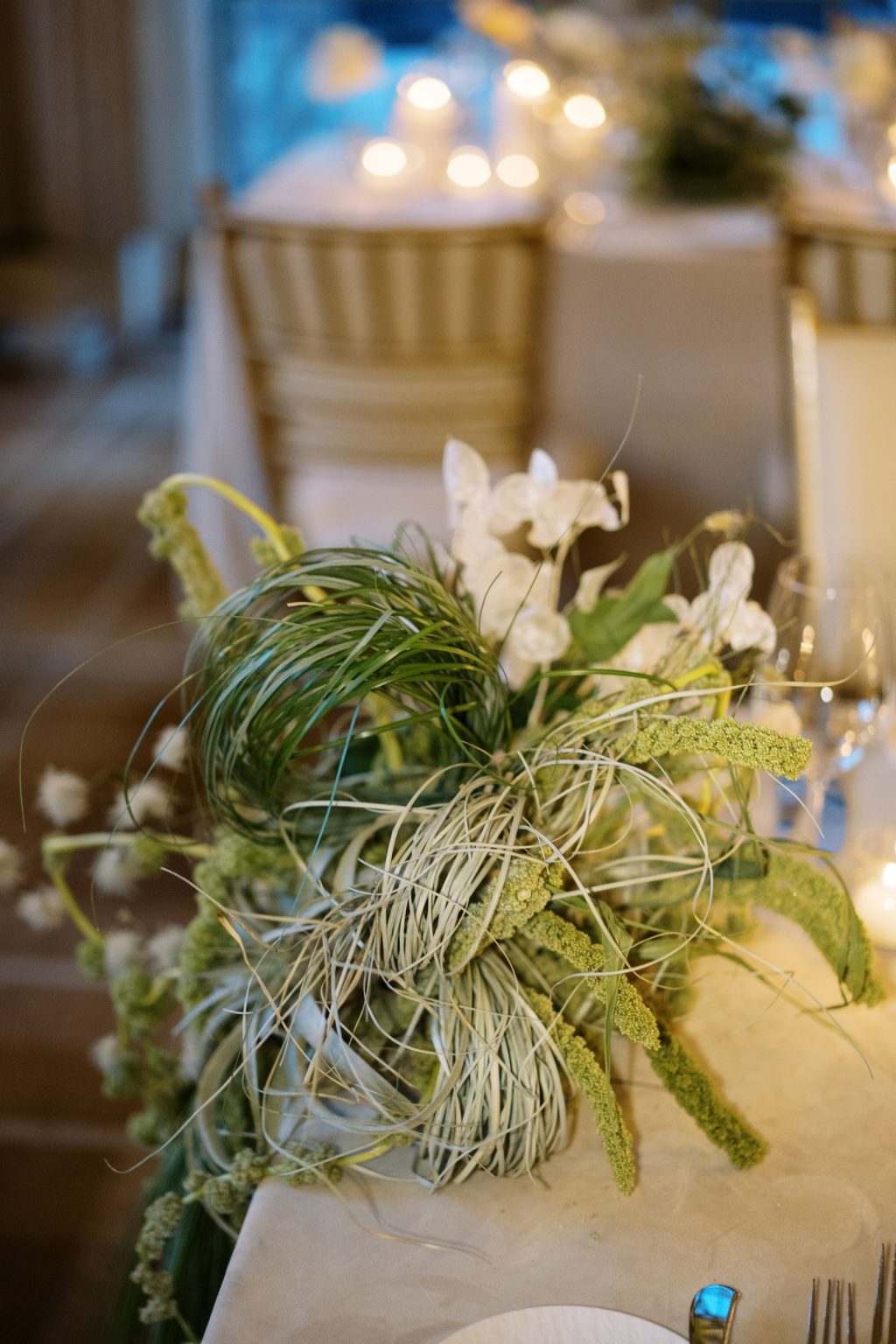 Abby & David's wedding at Hotel Jerome, Aspen: cascading grasses and white orchids