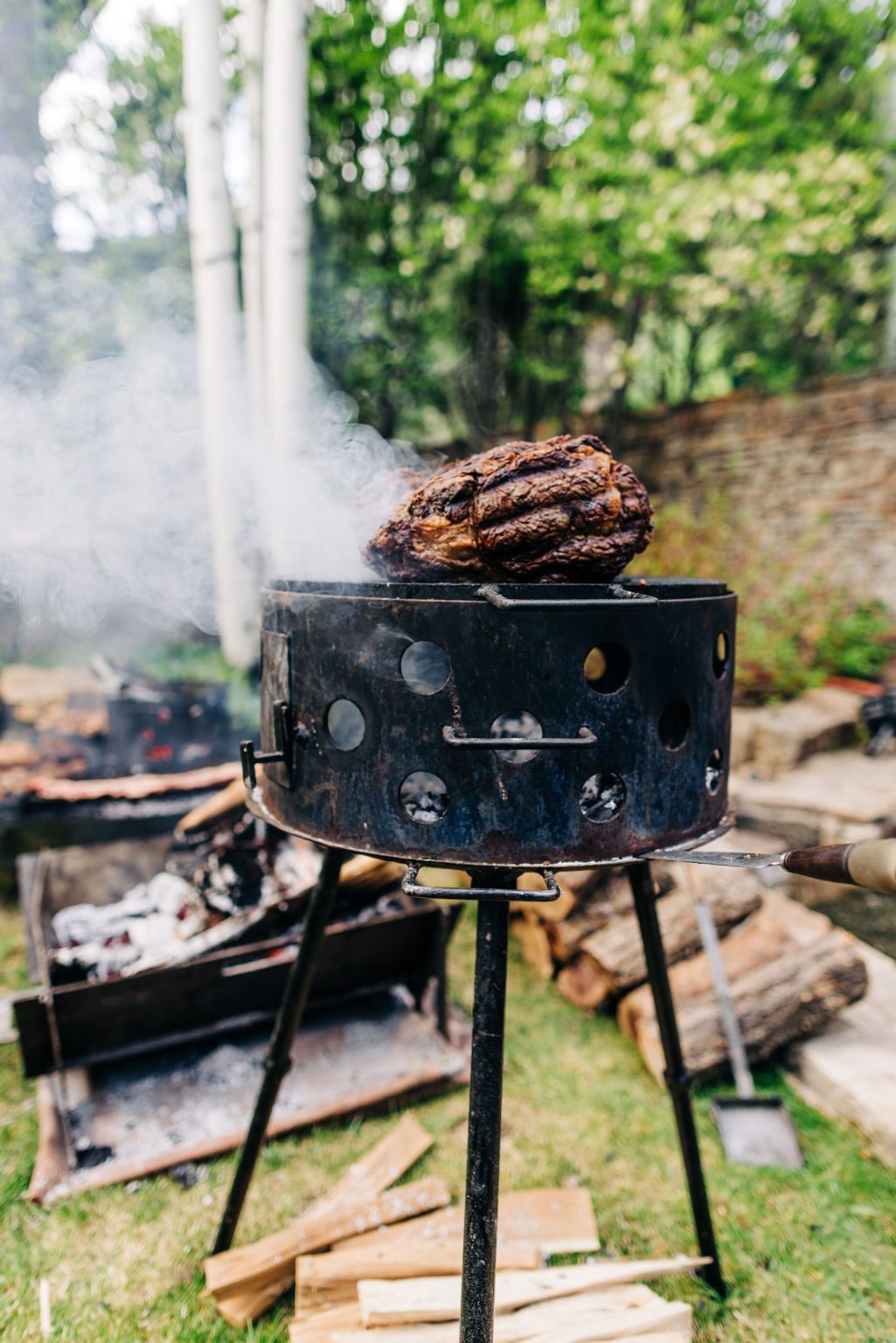 Julie & Tobias's wedding on the Northstar Preserve, Aspen: meats roasting over the asado fire