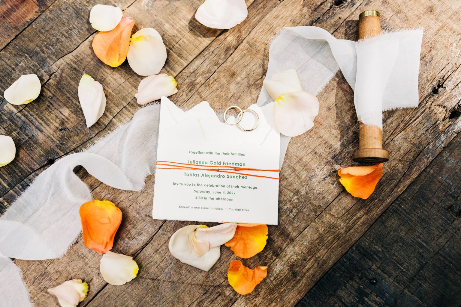 Julie & Tobias's wedding on the Northstar Preserve, Aspen: the invitation suite with ribbon and petals