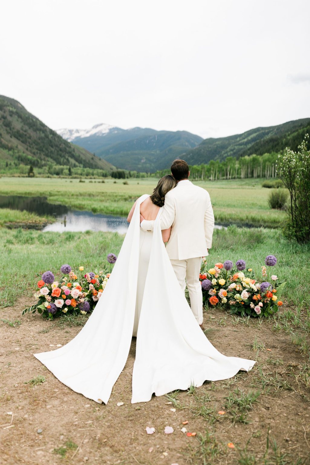 Julie & Tobias's wedding on the Northstar Preserve, Aspen: the couple facing the mountains