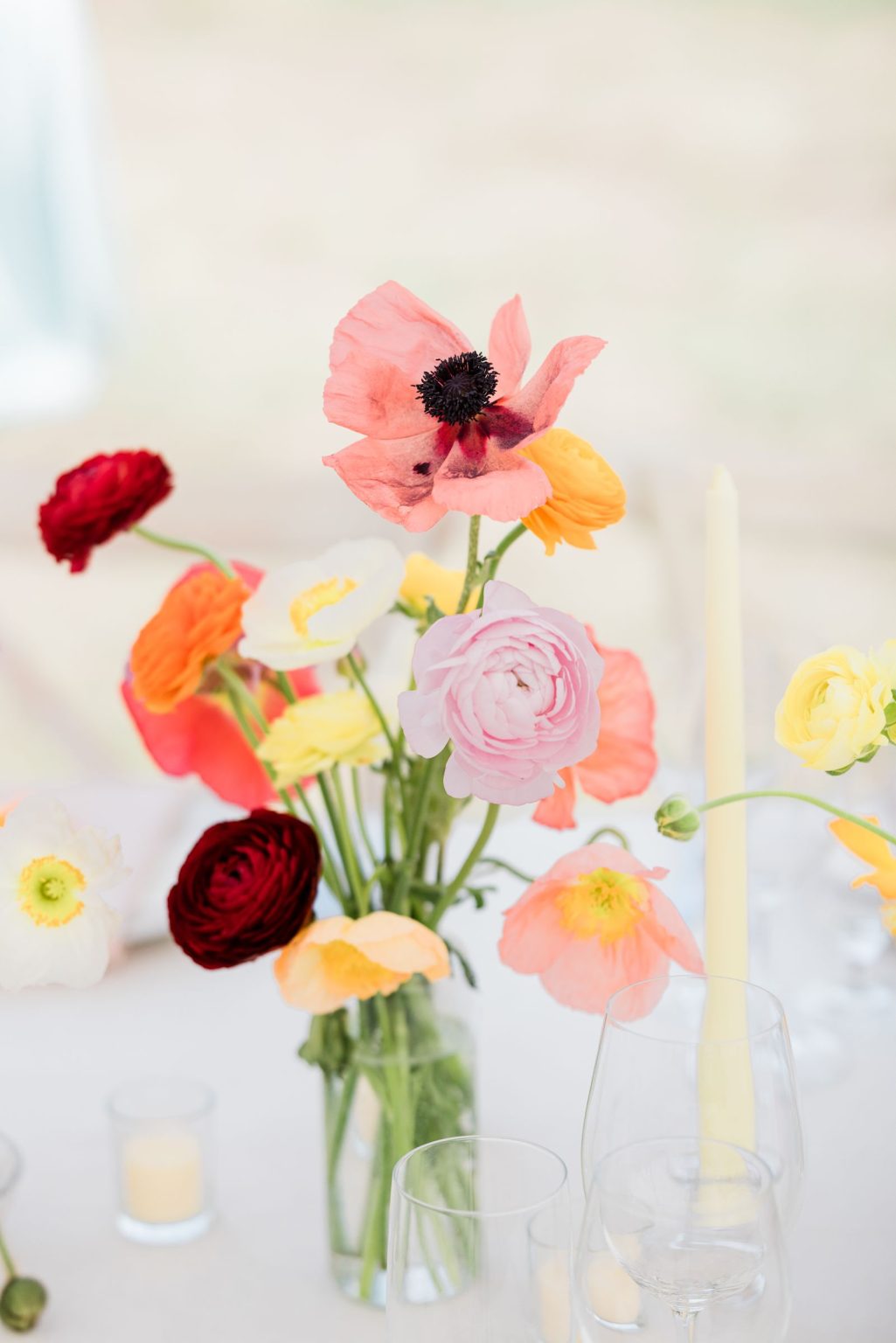 Julie & Tobias's wedding on the Northstar Preserve, Aspen: poppies and ranunculus in glass