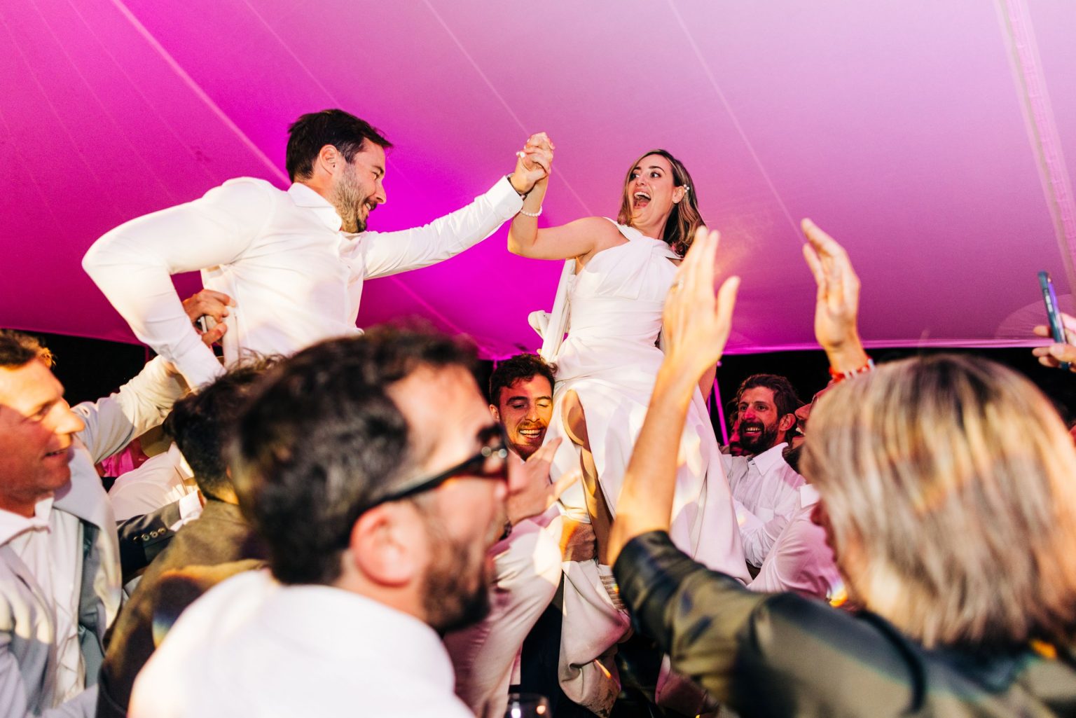 Julie & Tobias's wedding on the Northstar Preserve, Aspen: the hora under pink light