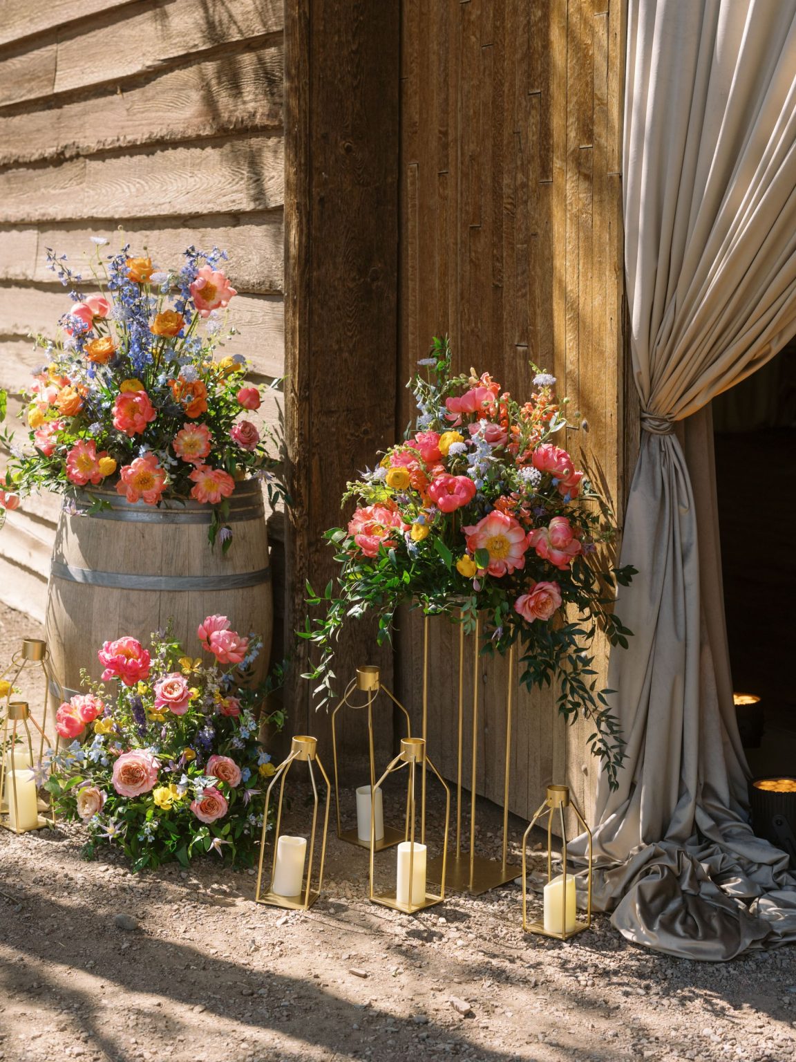 Clare and Kobe's McCabe Ranch wedding in Old Snowmass, Colorado: florals at the barn entrance