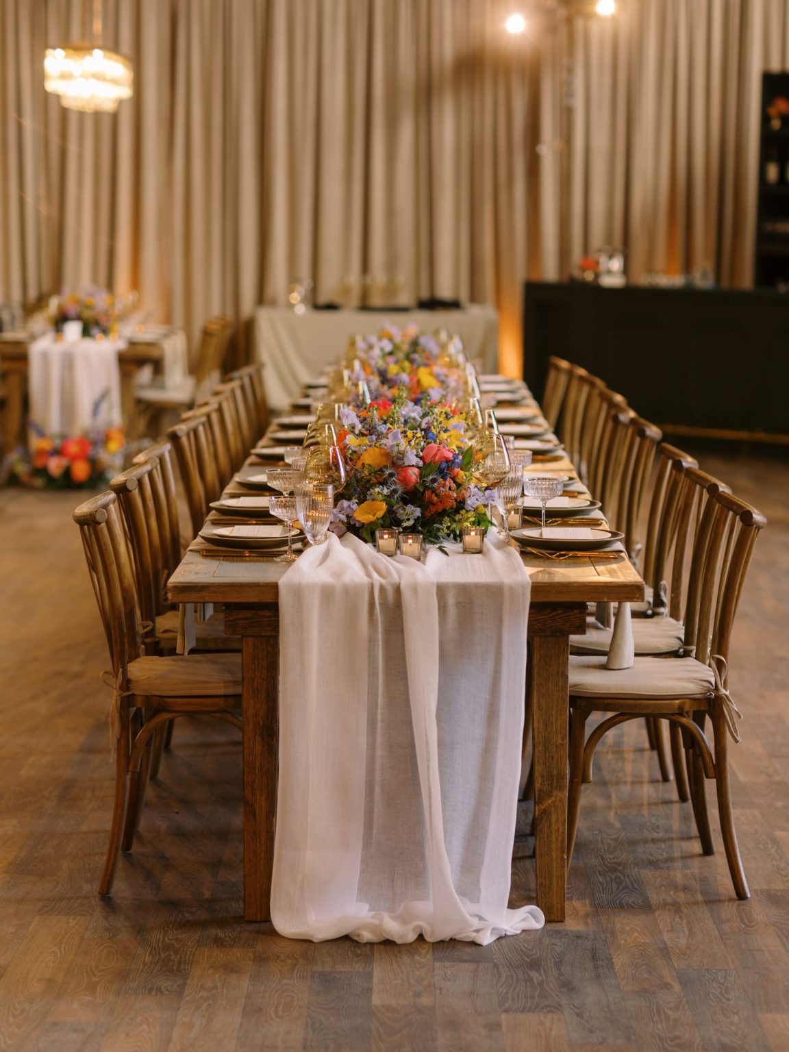 Clare and Kobe's McCabe Ranch wedding in Old Snowmass, Colorado: long farm table set for dinner