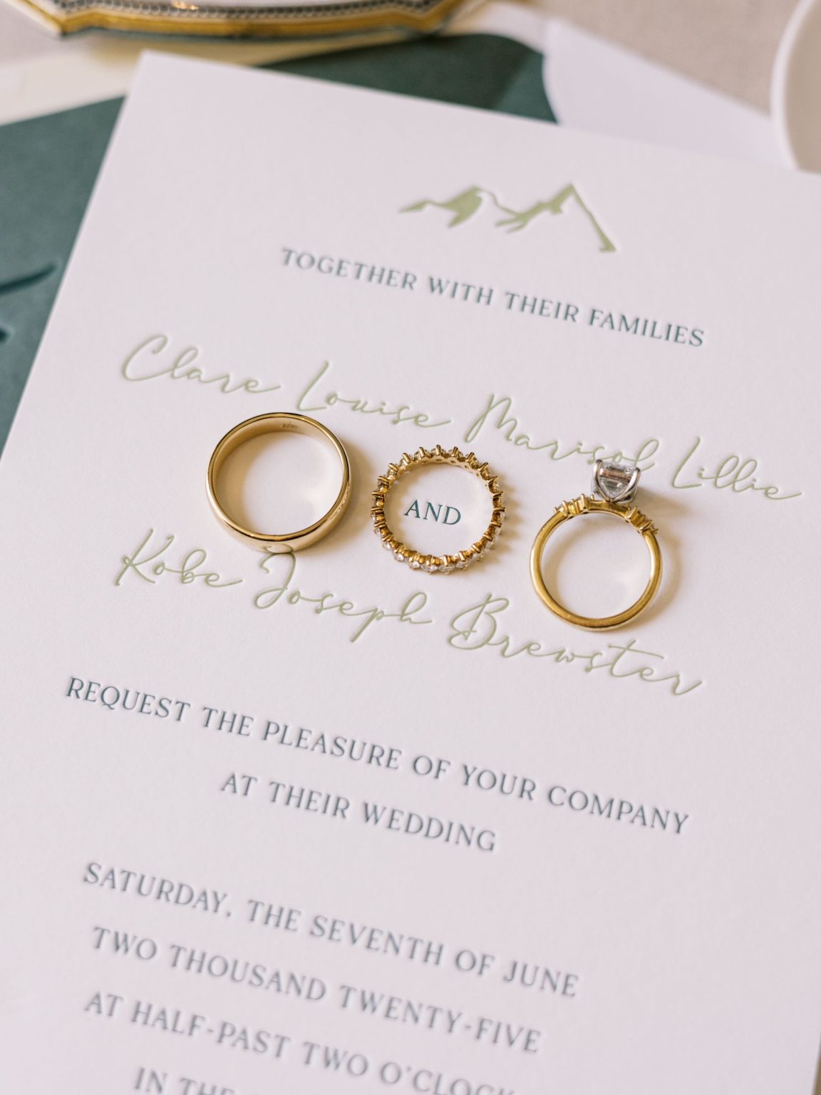 Clare and Kobe's McCabe Ranch wedding in Old Snowmass, Colorado: Carta Blanc invitation with the wedding rings
