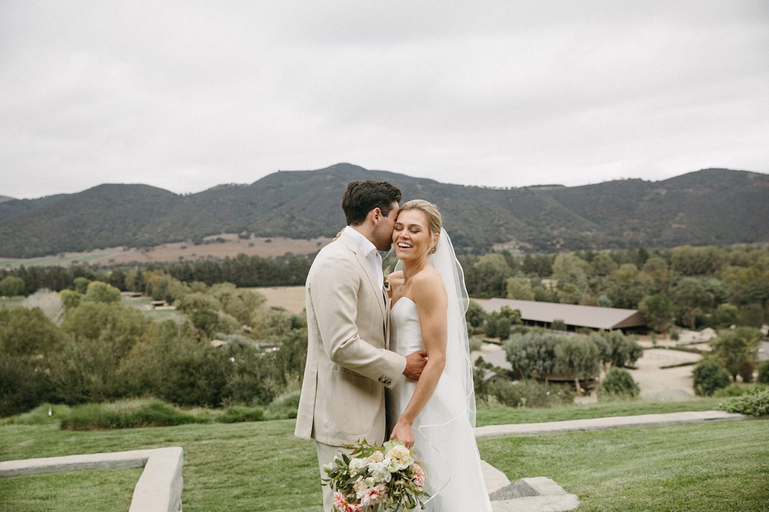 Anna and Sully's wedding at Whispering Rose Ranch, Santa Ynez, California: the couple above the Santa Ynez Valley