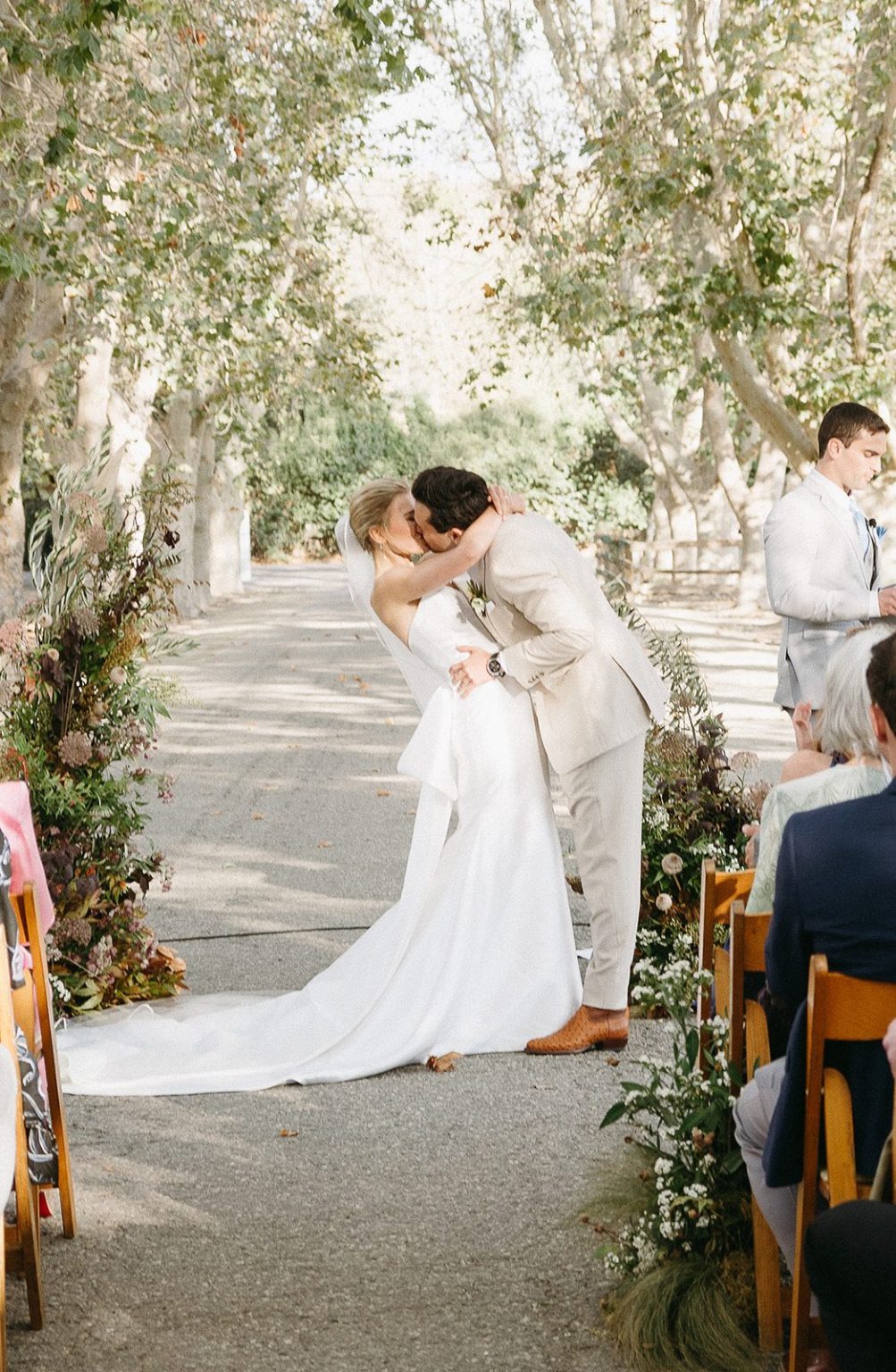 Anna and Sully's wedding at Whispering Rose Ranch, Santa Ynez, California: the kiss beneath the sycamores